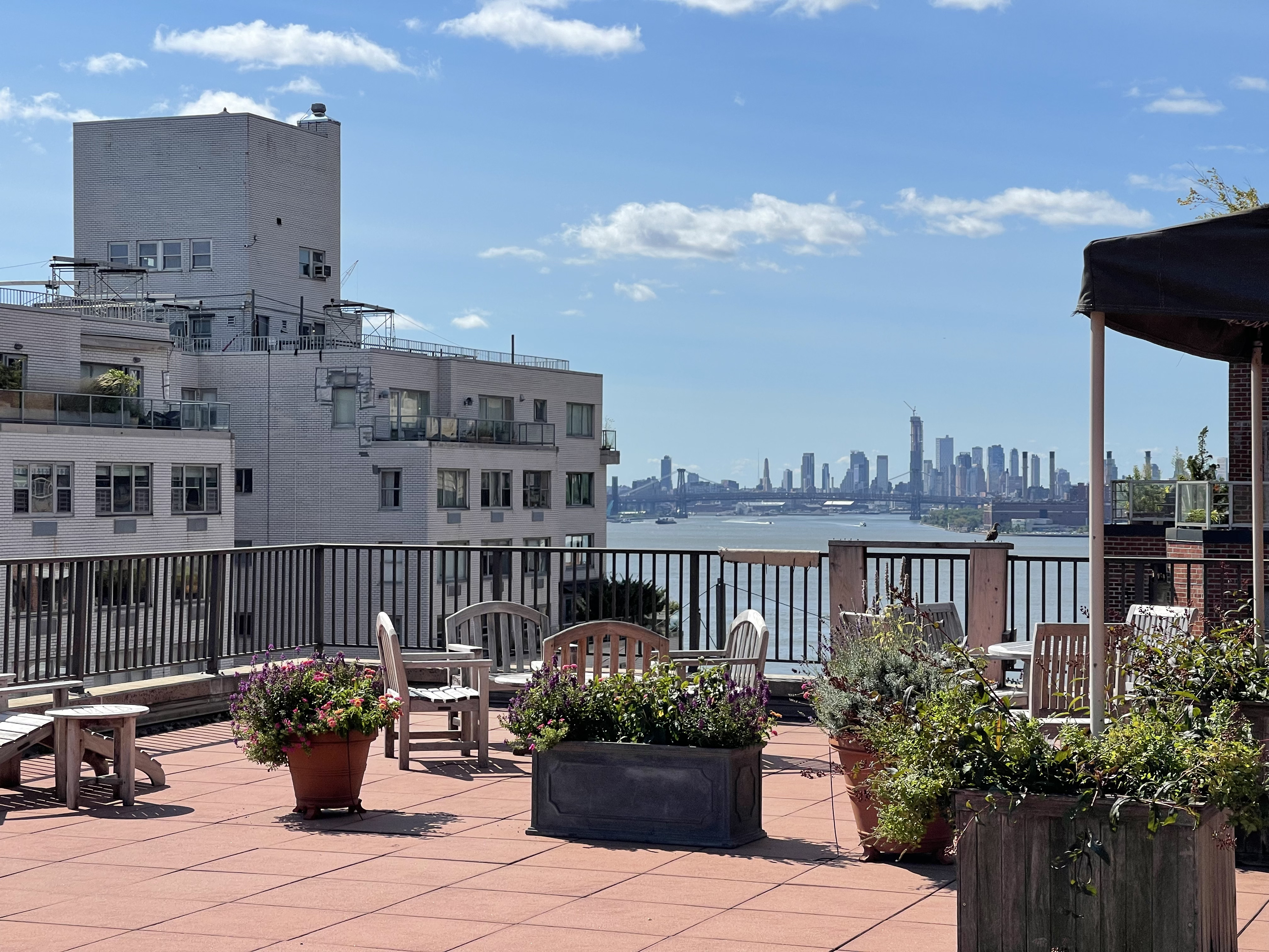 36 Sutton Place South, Unit 11D Manhattan, NY 10022 - Photo 10 of 11 a view of a balcony with chairs