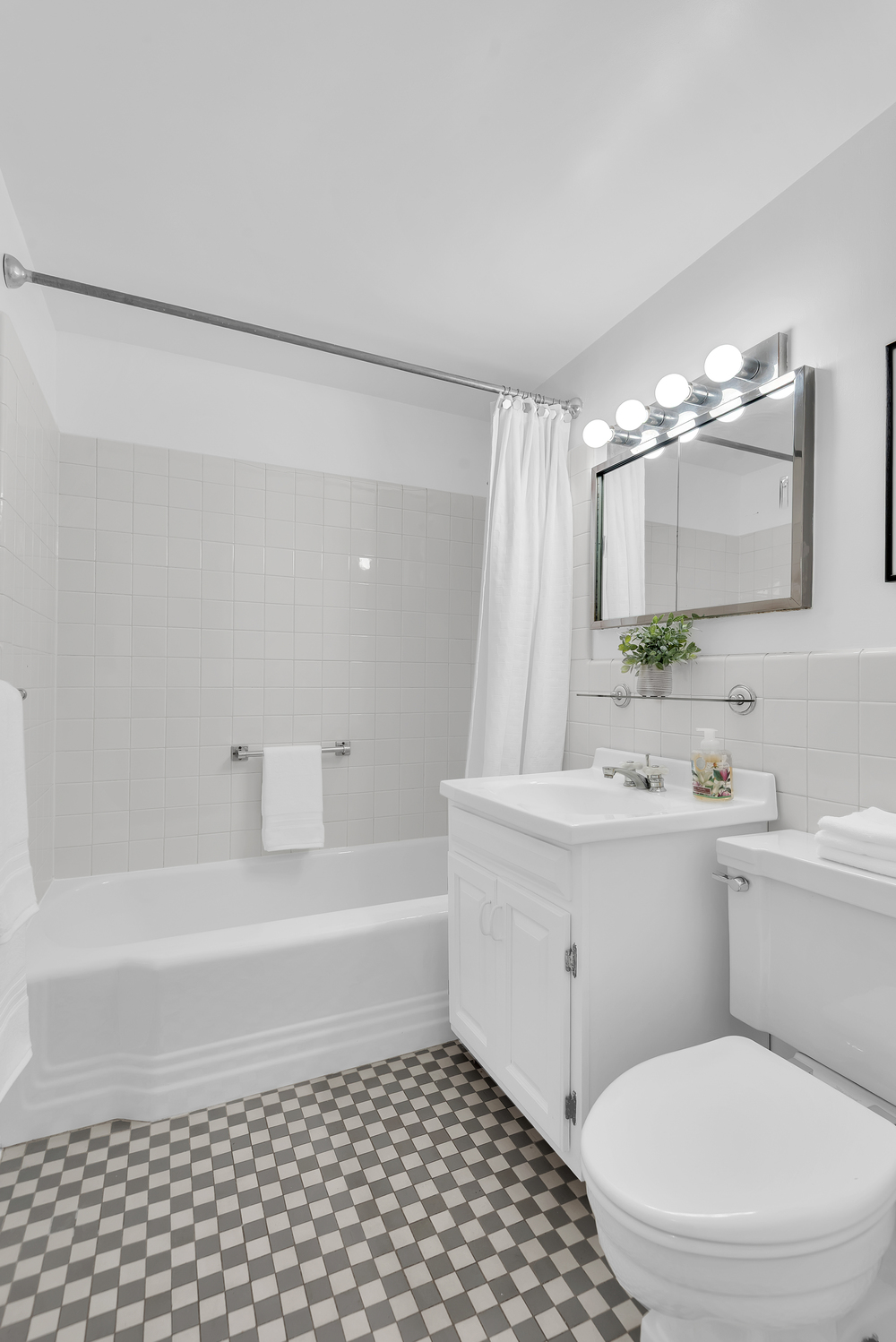 120 East 81st Street, Unit 8A Manhattan, NY 10028 - Photo 6 of 10 a bathroom with a sink a toilet and shower