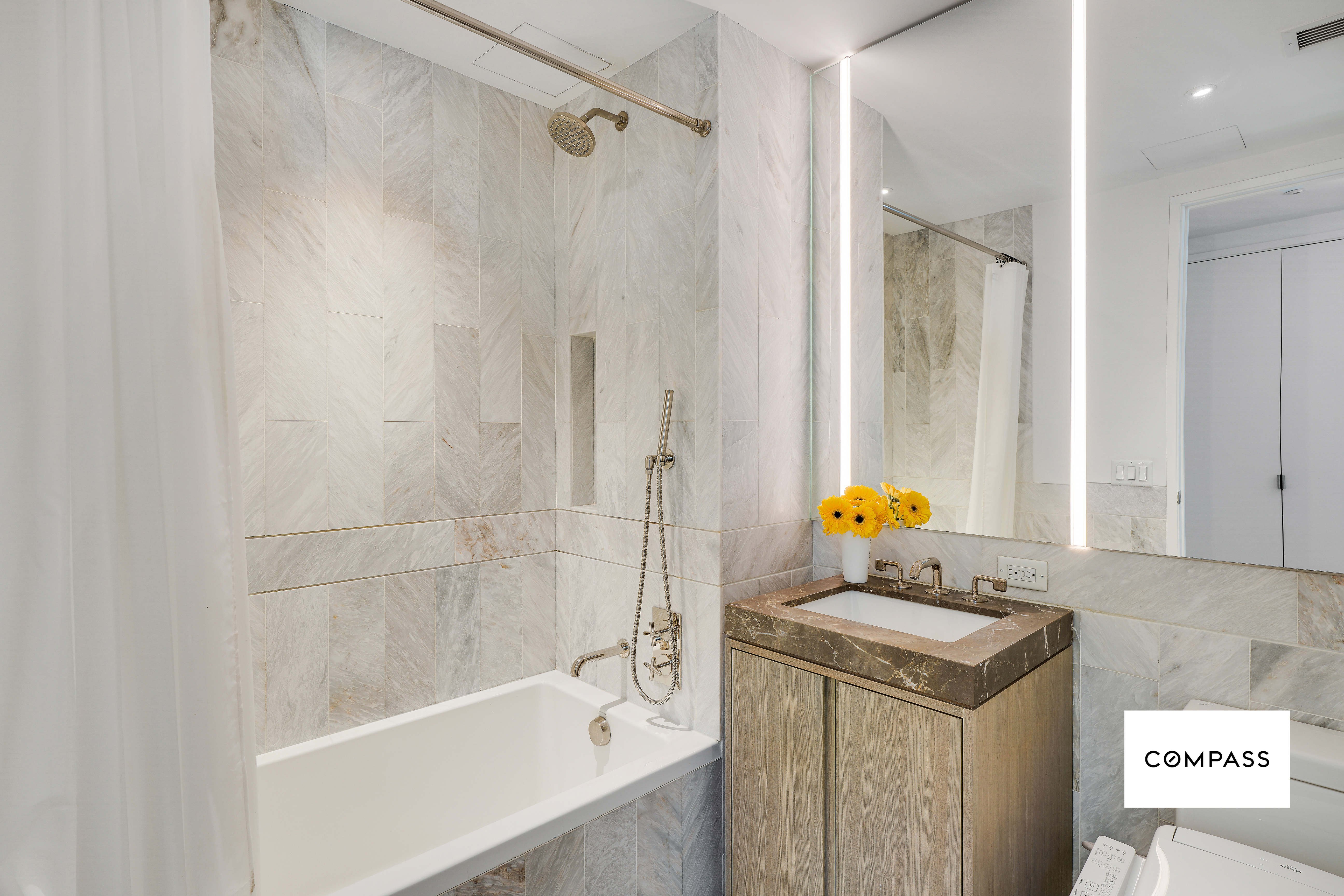 10 Nevins Street, Unit 14E Brooklyn, NY 11217 - Photo 5 of 11 a bathroom with a sink a toilet and shower