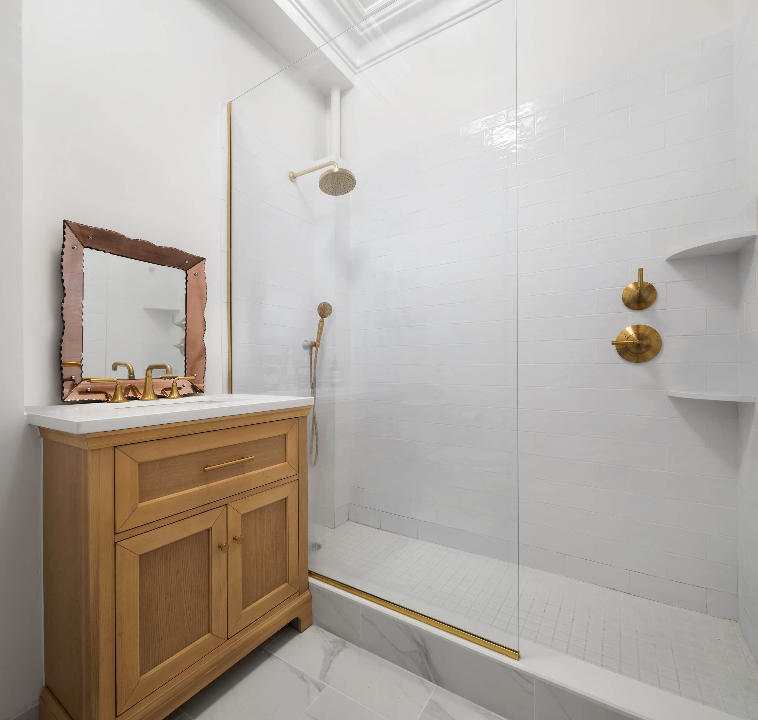 427 West 21st Street, Unit PARLOR Manhattan, NY 10011 - Photo 17 of 19 a bathroom with a shower sink and mirror