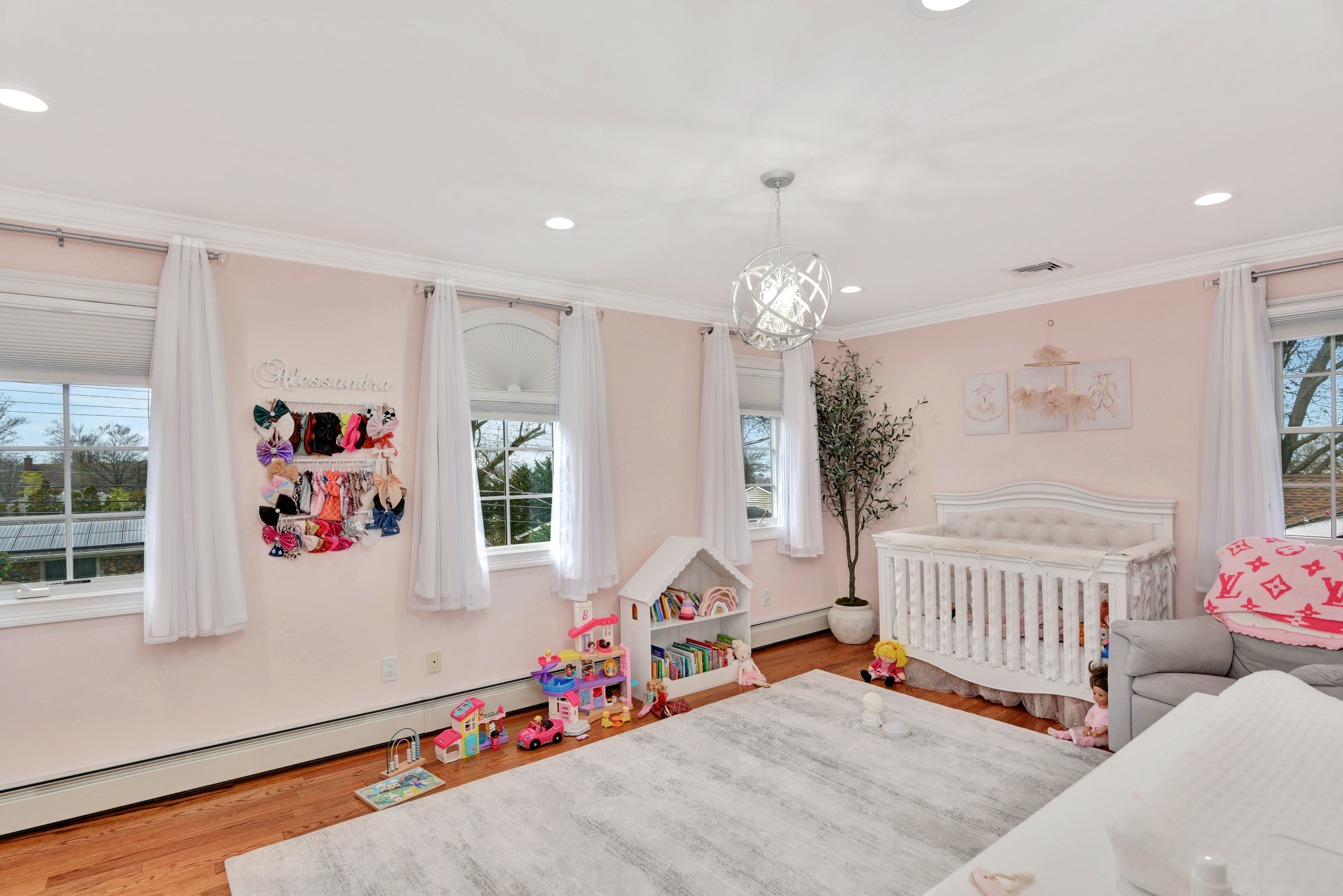 215 Lawrence Avenue Staten Island, NY 10310 - Photo 22 of 45 a living room with furniture and a chandelier