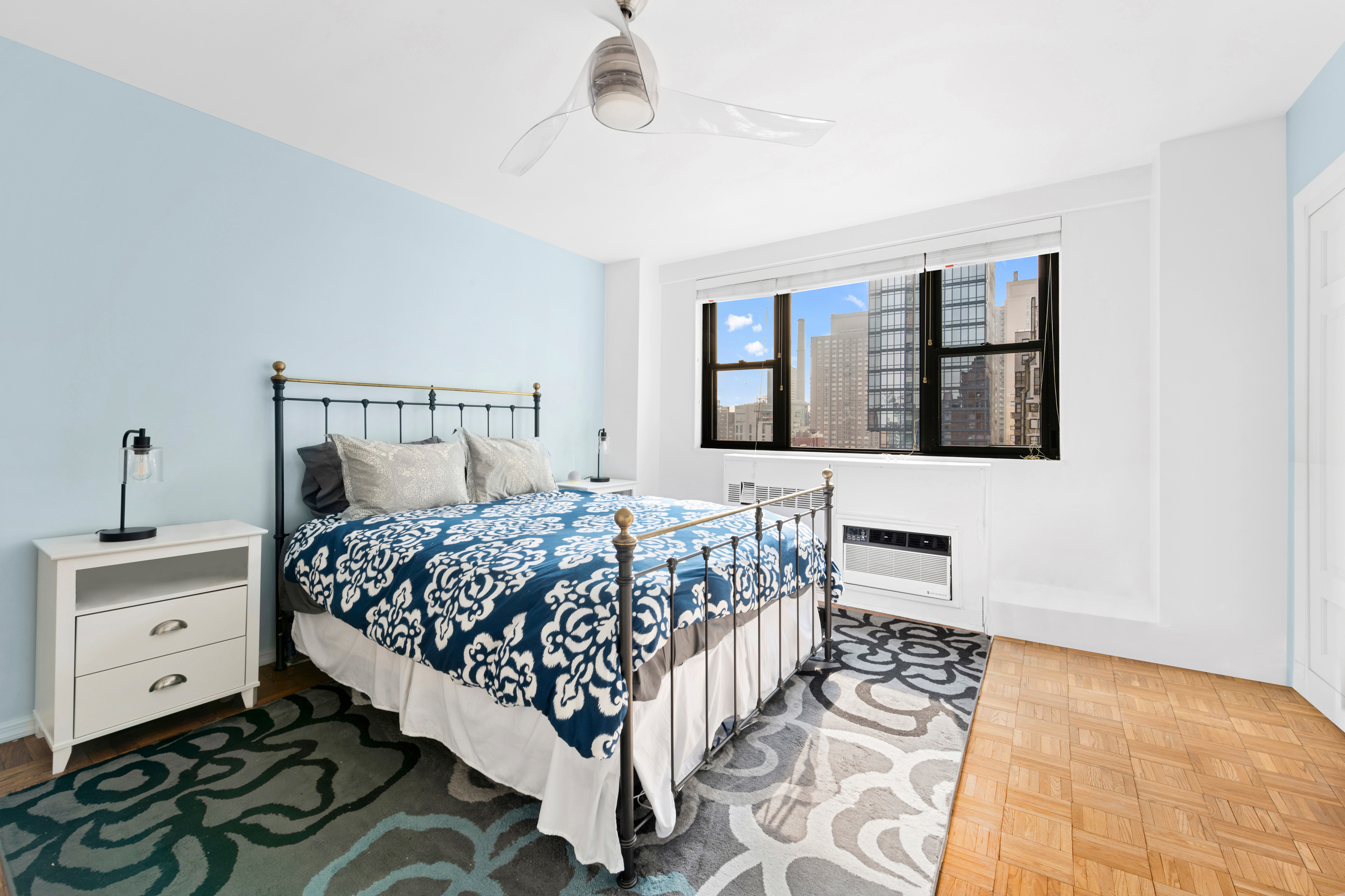 315 East 72nd Street, Unit 15M Manhattan, NY 10021 - Photo 10 of 18 a bedroom with a bed and a window
