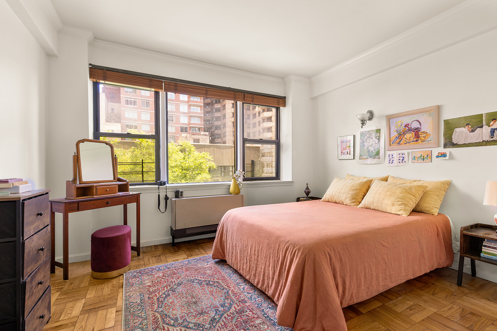 240 East 46th Street, Unit 7G Manhattan, NY 10017 - Photo 4 of 14 a bedroom with a large bed and a large window