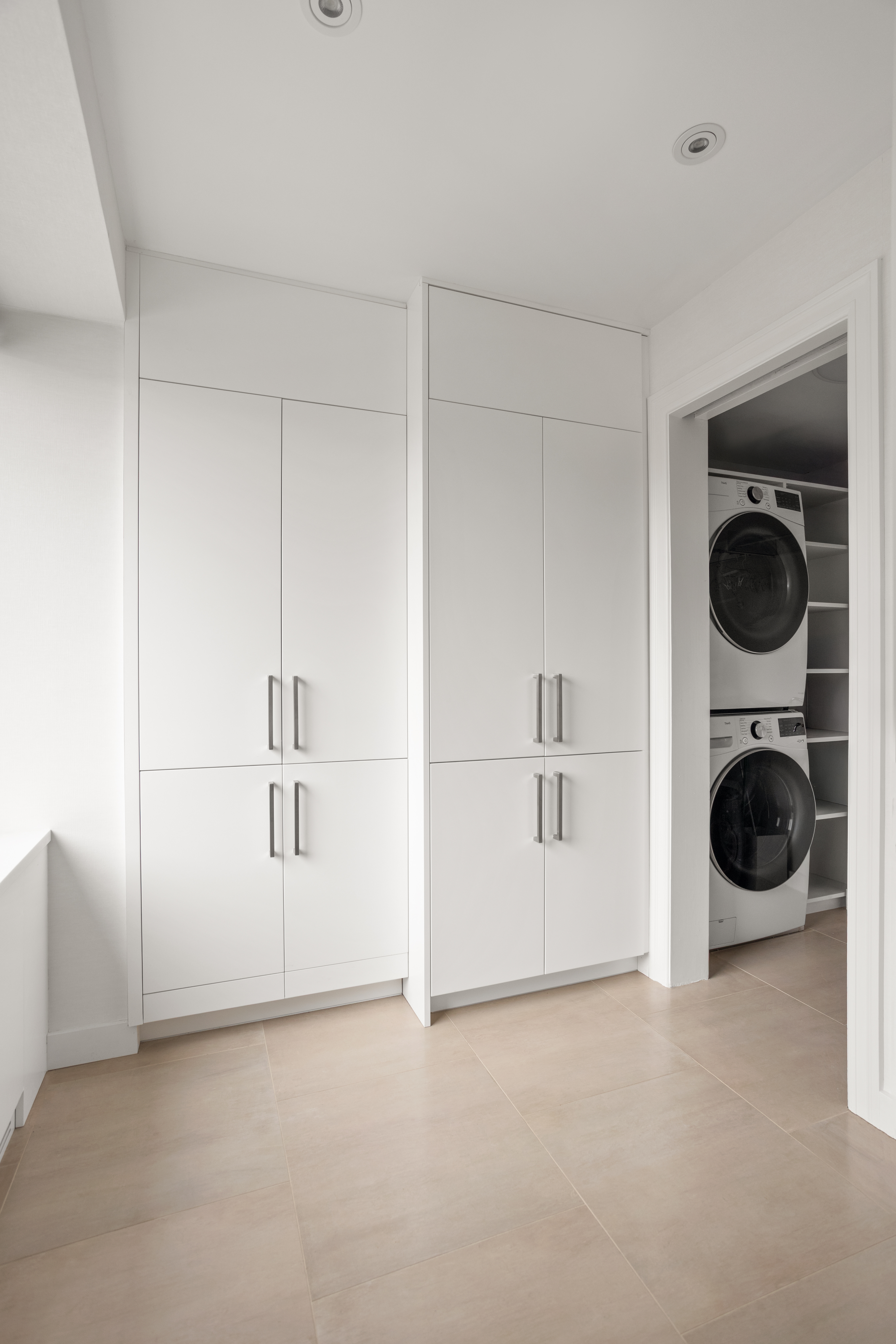 60 East End Avenue, Unit 12C Manhattan, NY 10028 - Photo 18 of 27 a view of a storage & utility room with a washer dryer