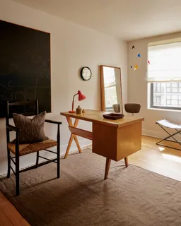 a workspace with furniture and window