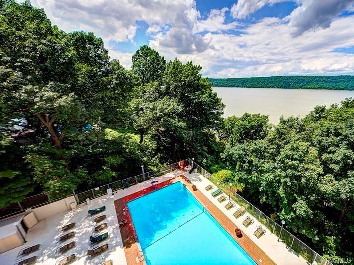 2621 Palisade Avenue, Unit 11J Bronx, NY 10463 - Photo 17 of 19 a view of a backyard with plants and a lake view