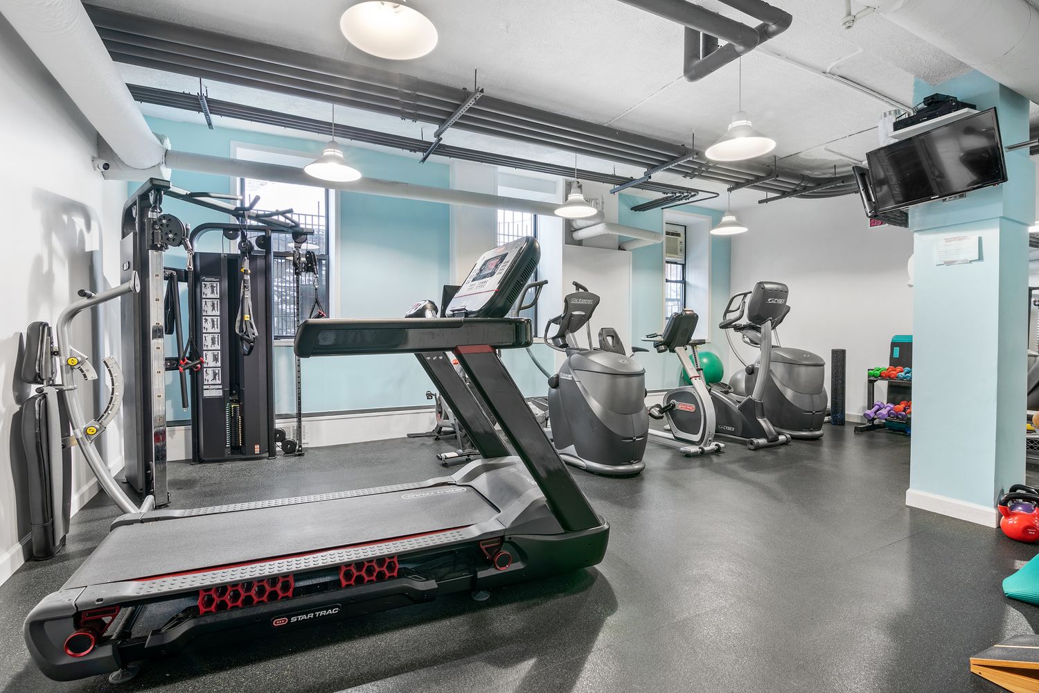 131 Riverside Drive, Unit 2C Manhattan, NY 10024 - Photo 14 of 17 a gym room with gym equipment