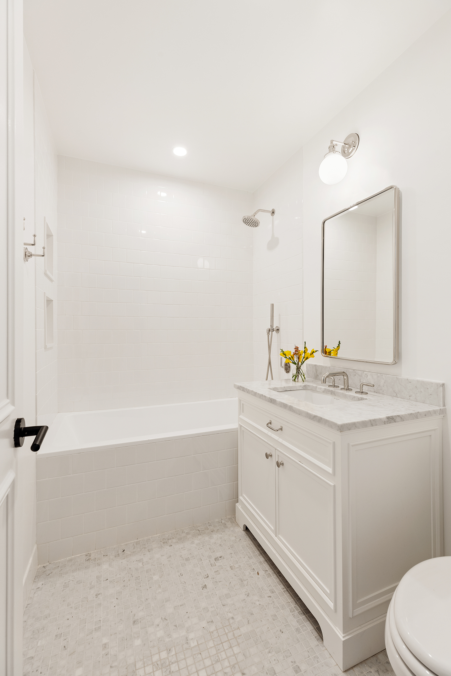 524 Halsey Street, Unit TH1 Brooklyn, NY 11233 - Photo 11 of 17 a bathroom with a granite countertop sink a toilet and bathtub