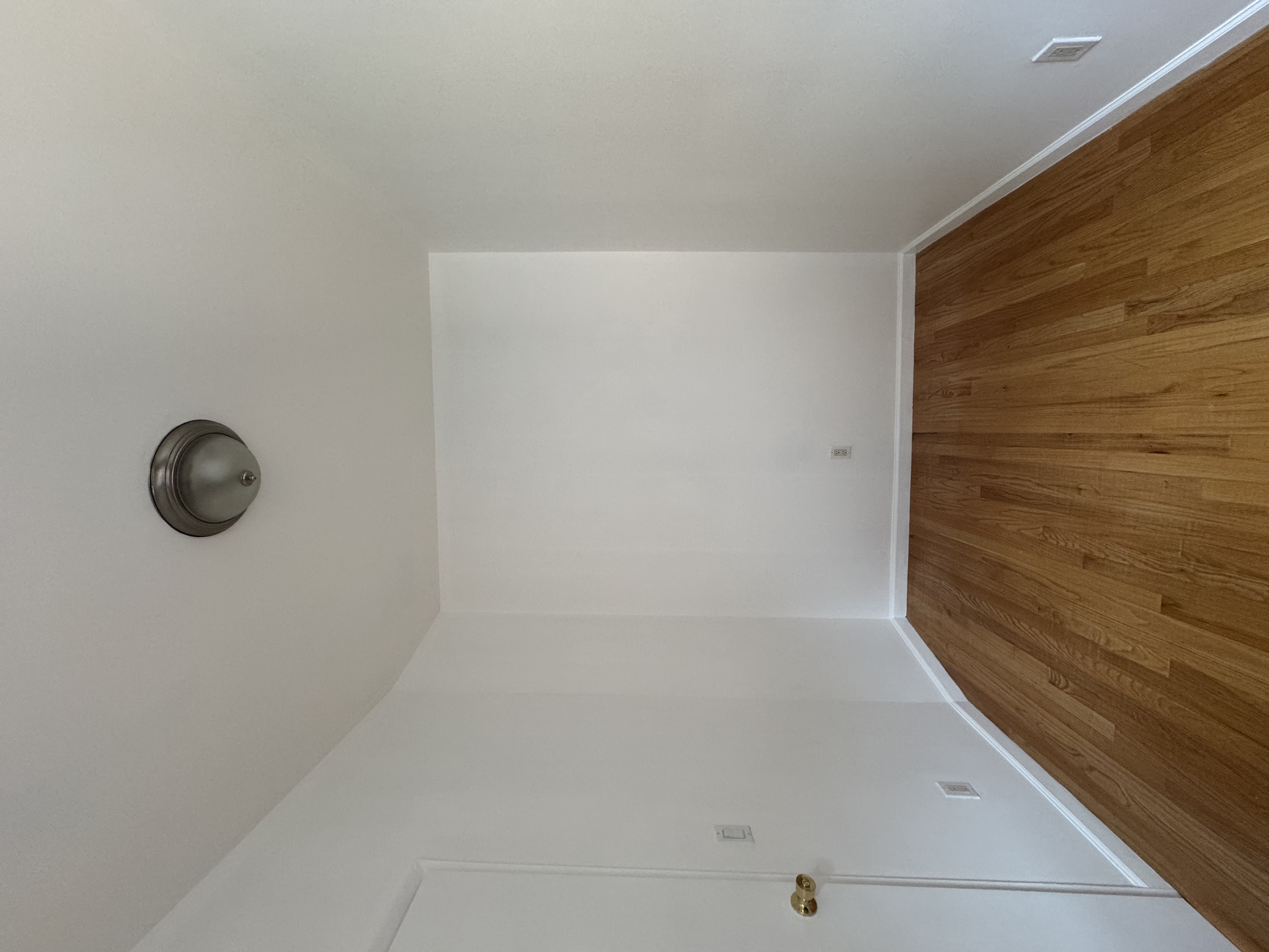451 West 44th Street, Unit 63 Manhattan, NY 10036 - Photo 3 of 31 a view of a room with wooden floor