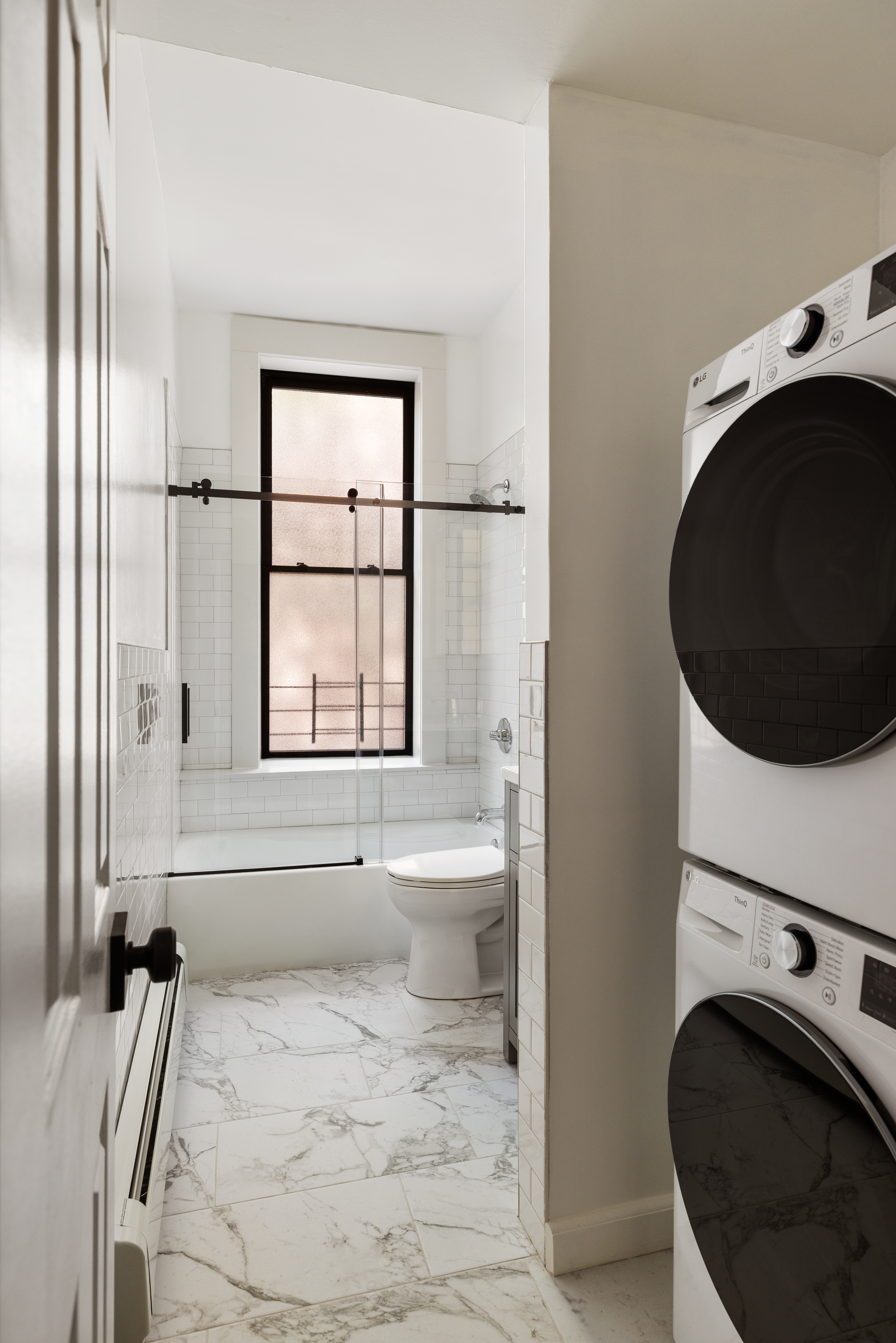 280 Clinton Street, Unit 1 Brooklyn, NY 11201 - Photo 6 of 11 a bathroom with a granite countertop sink a toilet and shower