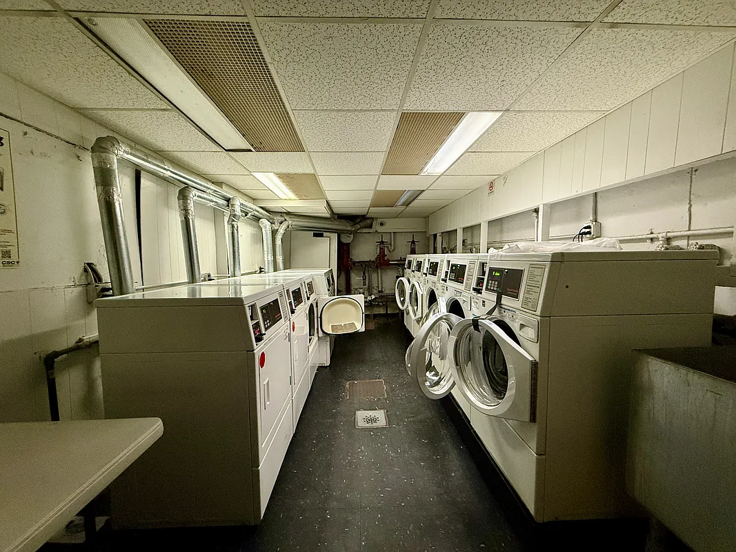 229 East 29th Street, Unit 3A Manhattan, NY 10016 - Photo 7 of 7 a utility room with multiple dryer and washer