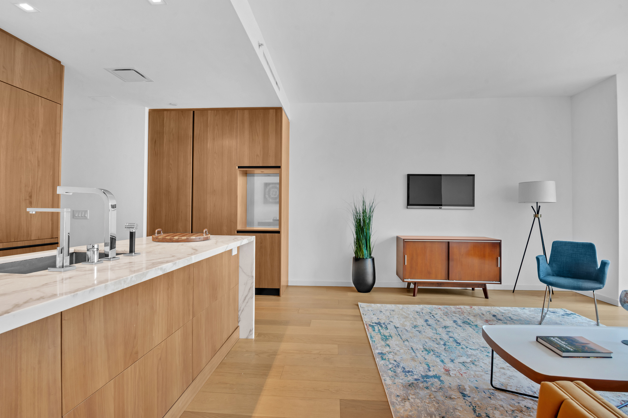 1 West End Avenue, Unit 16L Manhattan, NY 10069 - Photo 4 of 11 a living room with furniture and a wooden floor