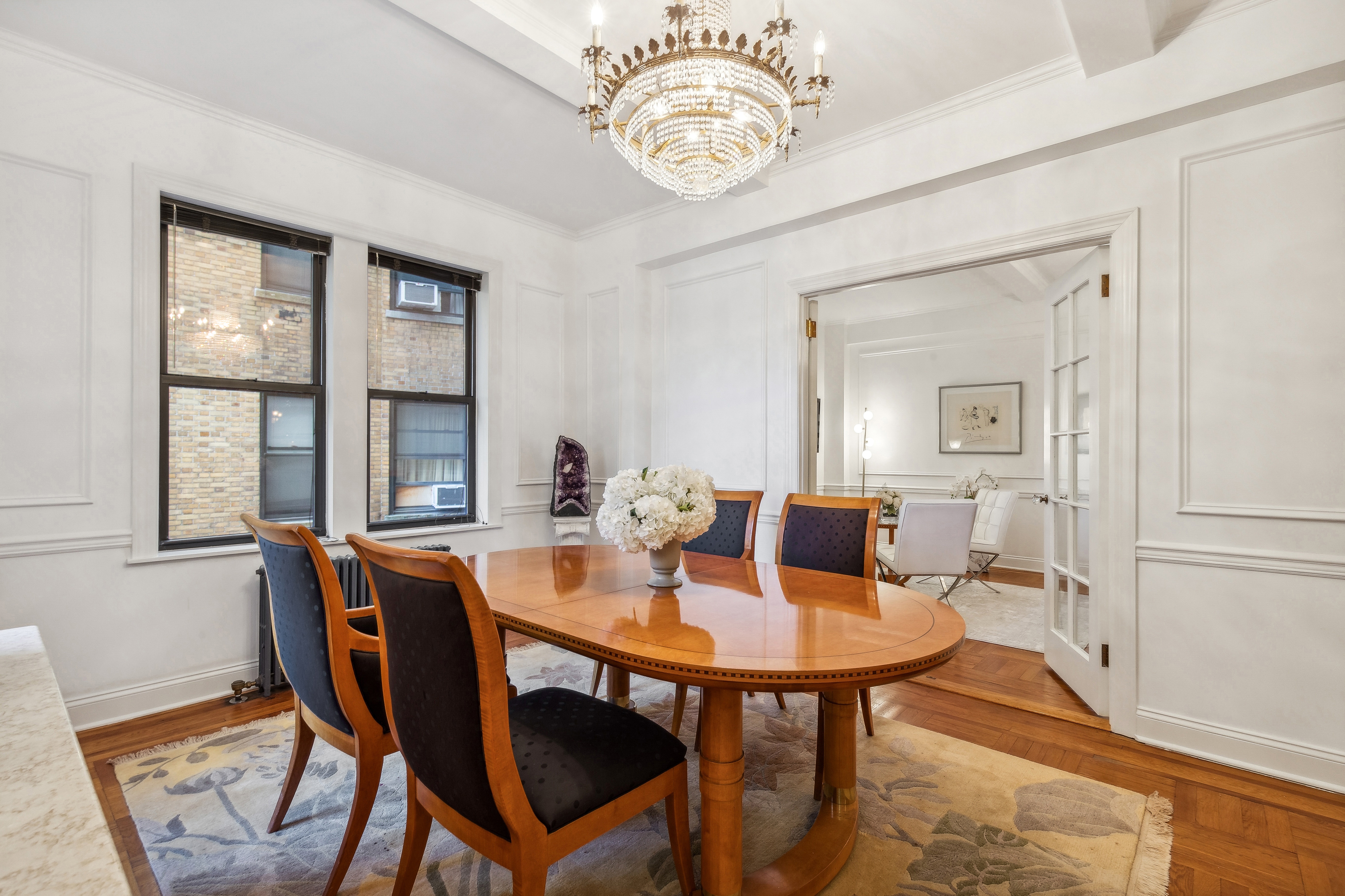 300 Riverside Drive, Unit 5E Manhattan, NY 10025 - Photo 4 of 11 a view of a dining room with furniture window and wooden floor