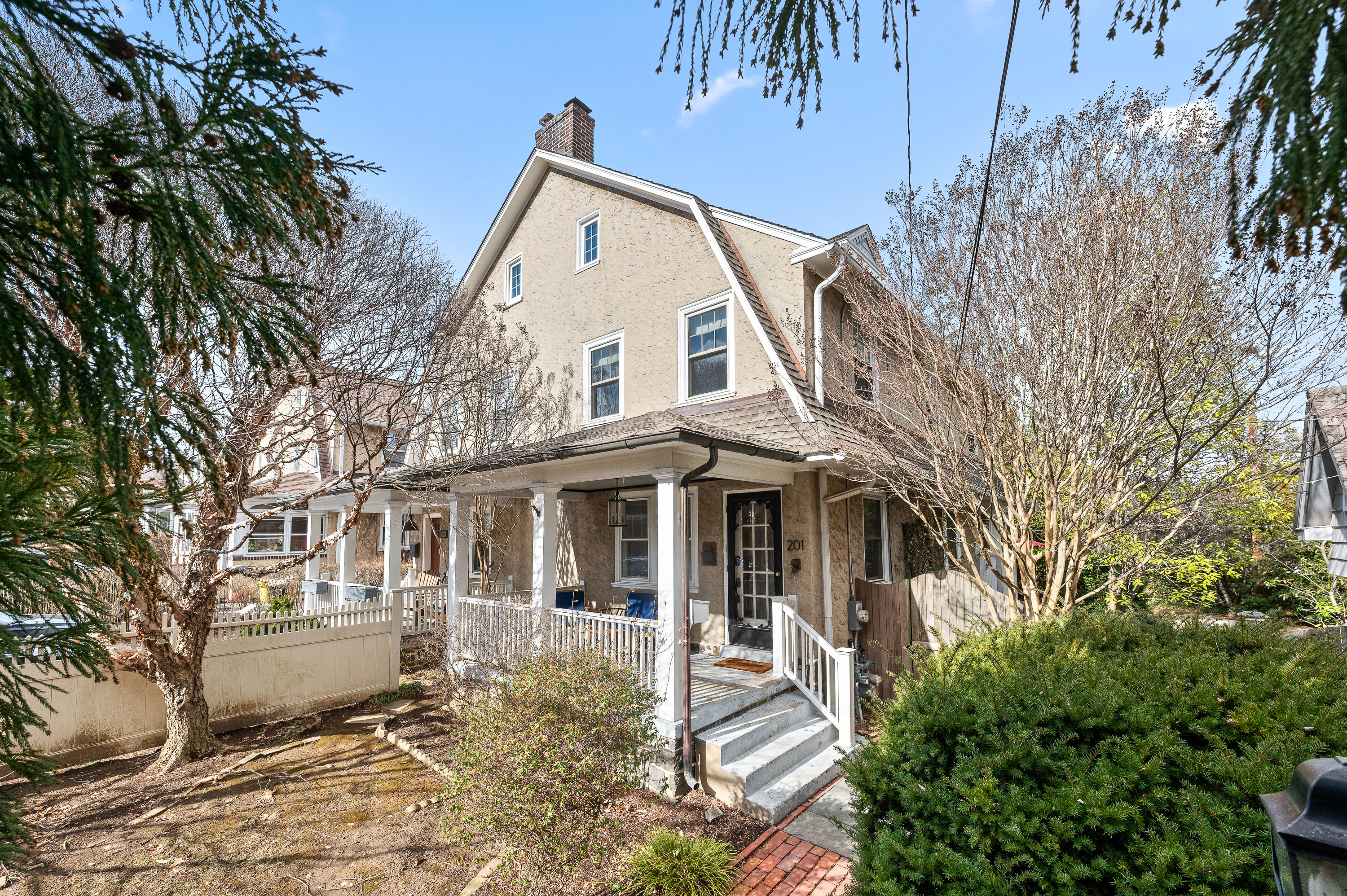 201 West Avenue Wayne, PA 19087 - Photo 26 of 26 a view of a white house next to a yard with big trees