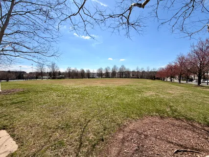 a view of a field with an outdoor space