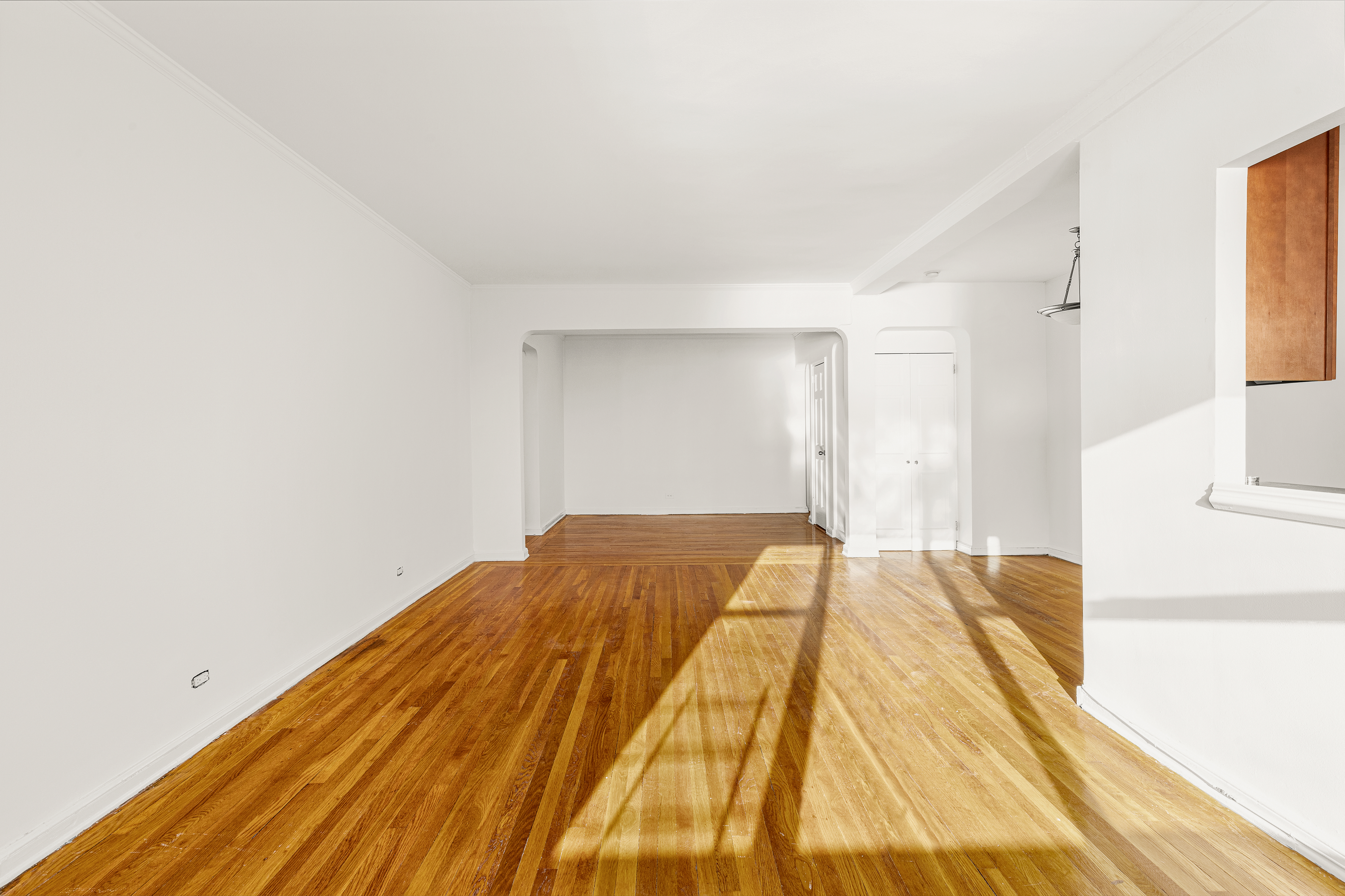 158-18 Riverside Drive West, Unit 4E50 Manhattan, NY 10032 - Photo 3 of 17 a bed sitting in a spacious bedroom next to a window