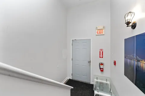 a kitchen with stainless steel appliances a stove refrigerator sink and cabinets