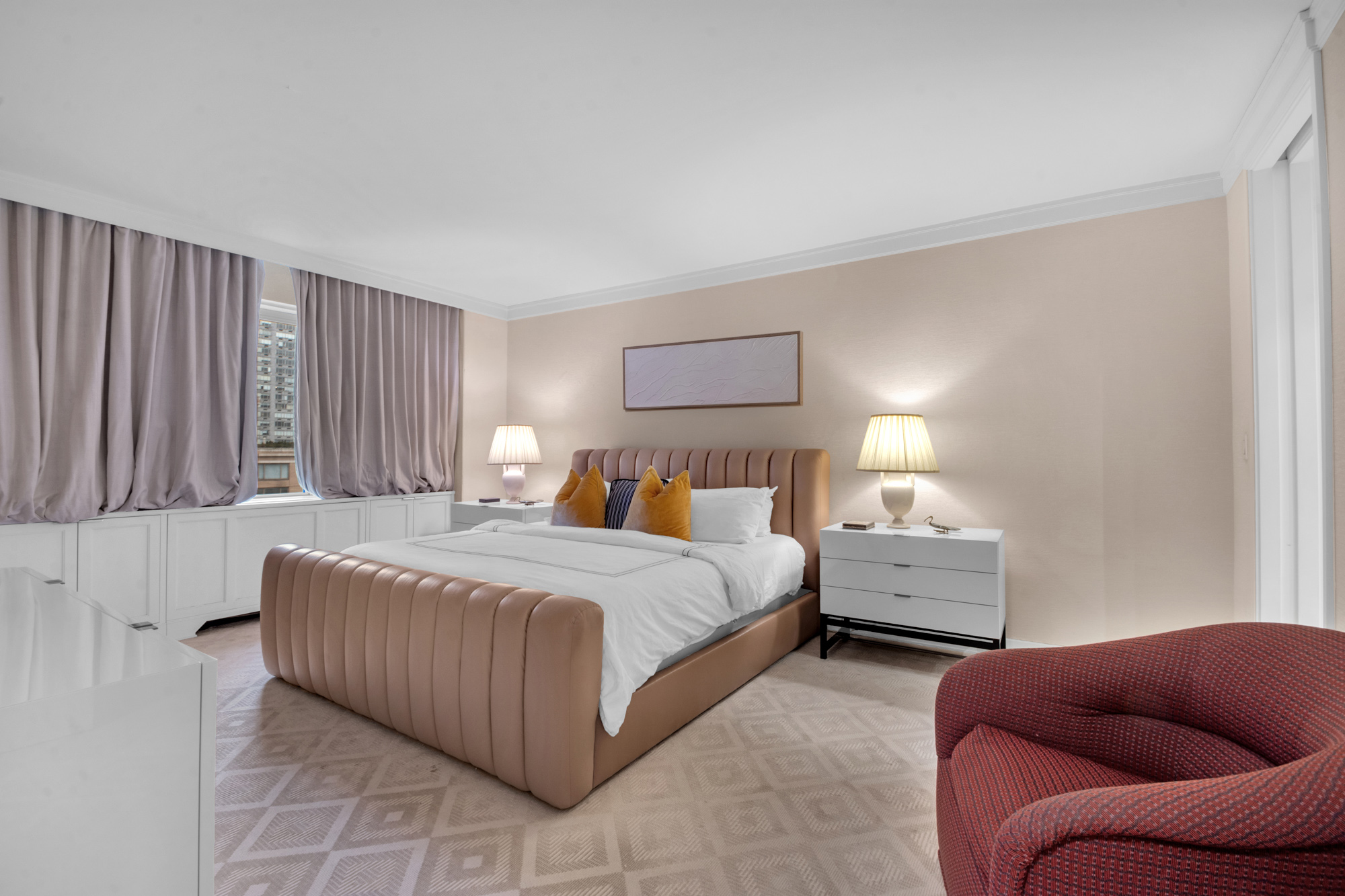 150 East 69th Street, Unit 6Q Manhattan, NY 10021 - Photo 12 of 15 a bedroom with bed couch and window