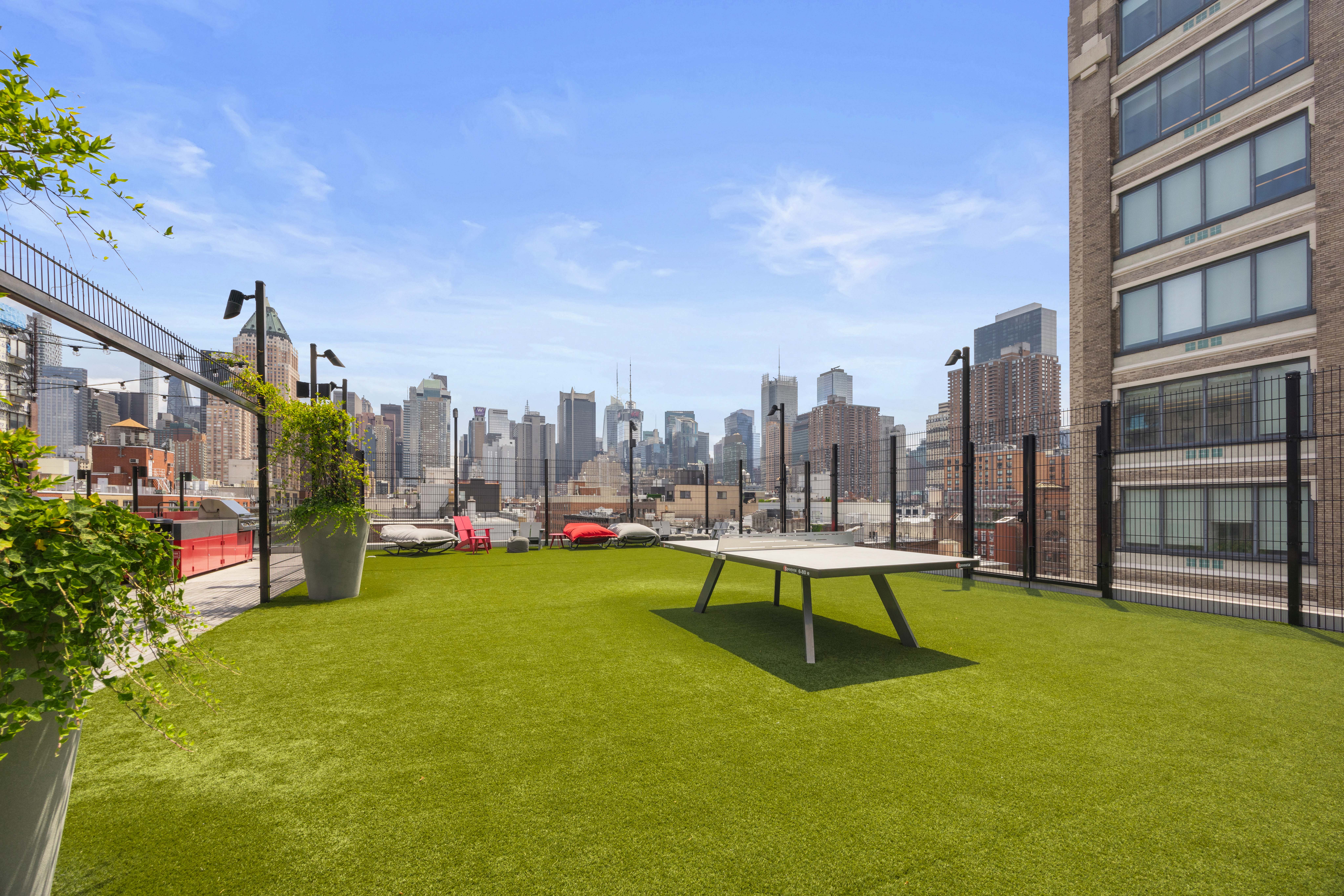 547 West 47th Street, Unit 509 Manhattan, NY 10036 - Photo 21 of 29 a view of a swimming pool with a bench and trees