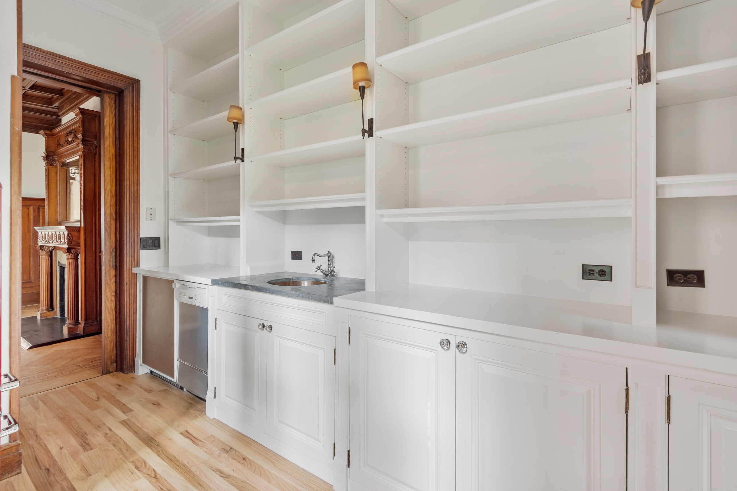 616 2nd Street Brooklyn, NY 11215 - Photo 9 of 19 a kitchen with granite countertop white cabinets and white appliances