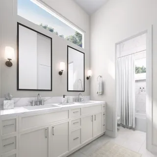 a bathroom with a double vanity sink mirror and next to a window