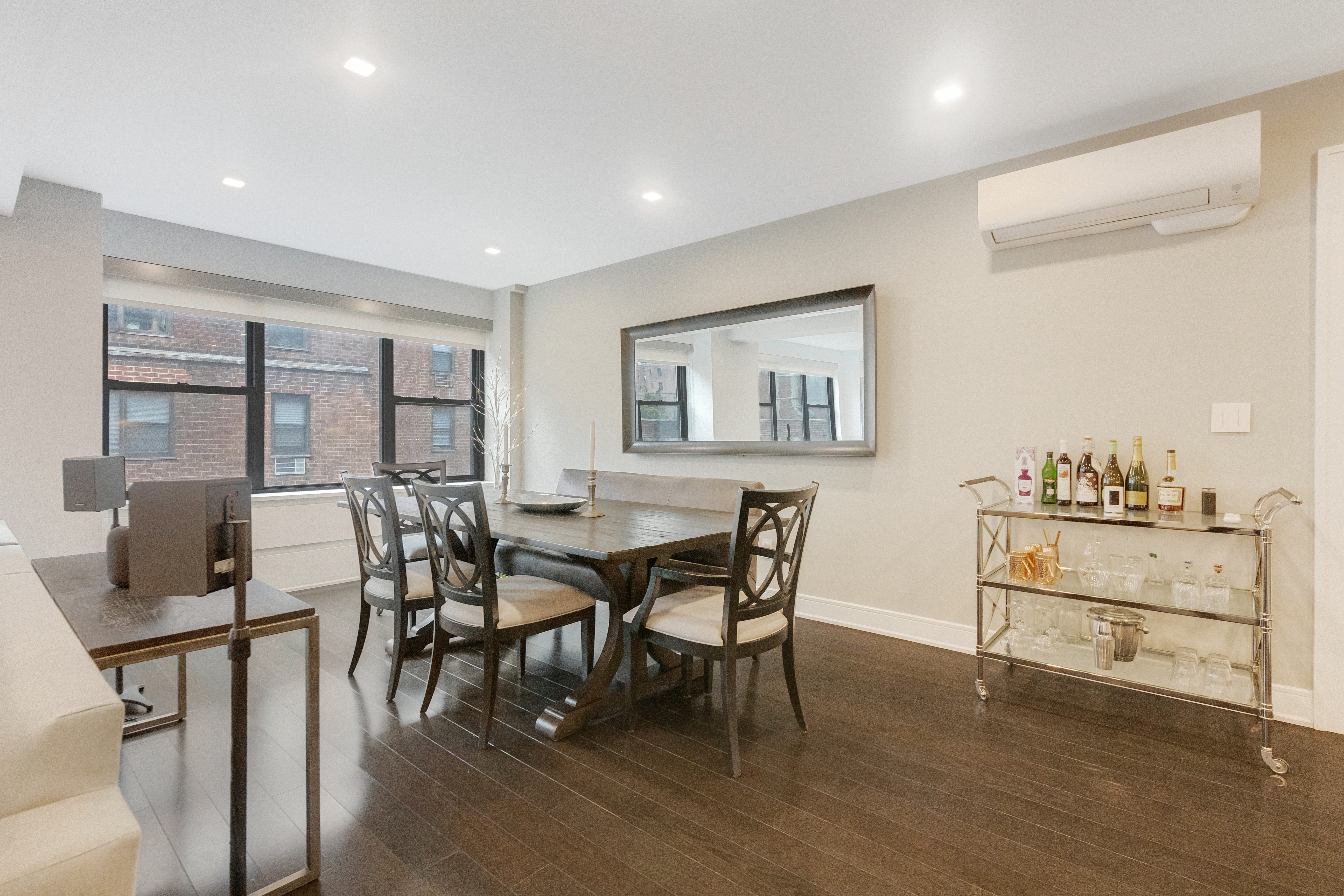 2 Tudor City Place, Unit 12DS Manhattan, NY 10017 - Photo 4 of 20 a view of a dining room with furniture and wooden floor