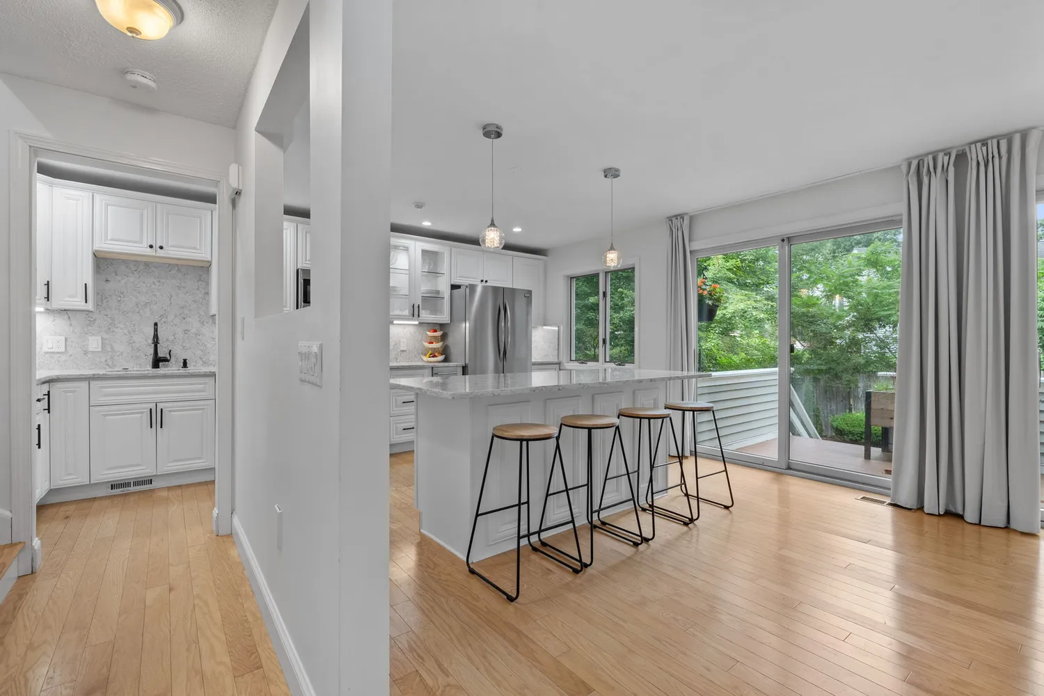 a view of a kitchen from the living room
