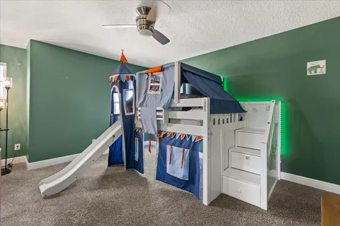 a view of yard and basketball court