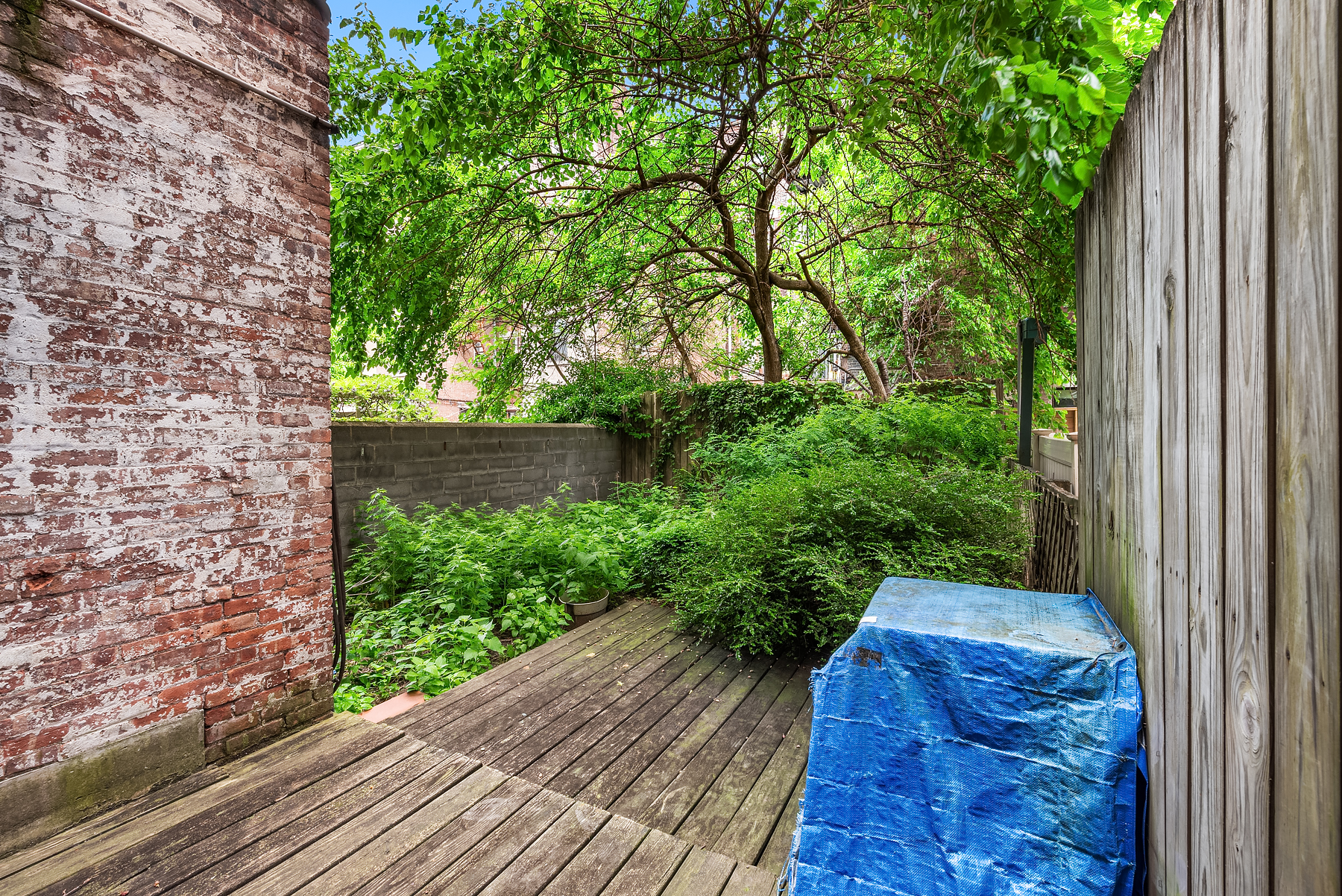 131 West 118th Street Manhattan, NY 10026 - Photo 7 of 8 a view of balcony with wooden floor