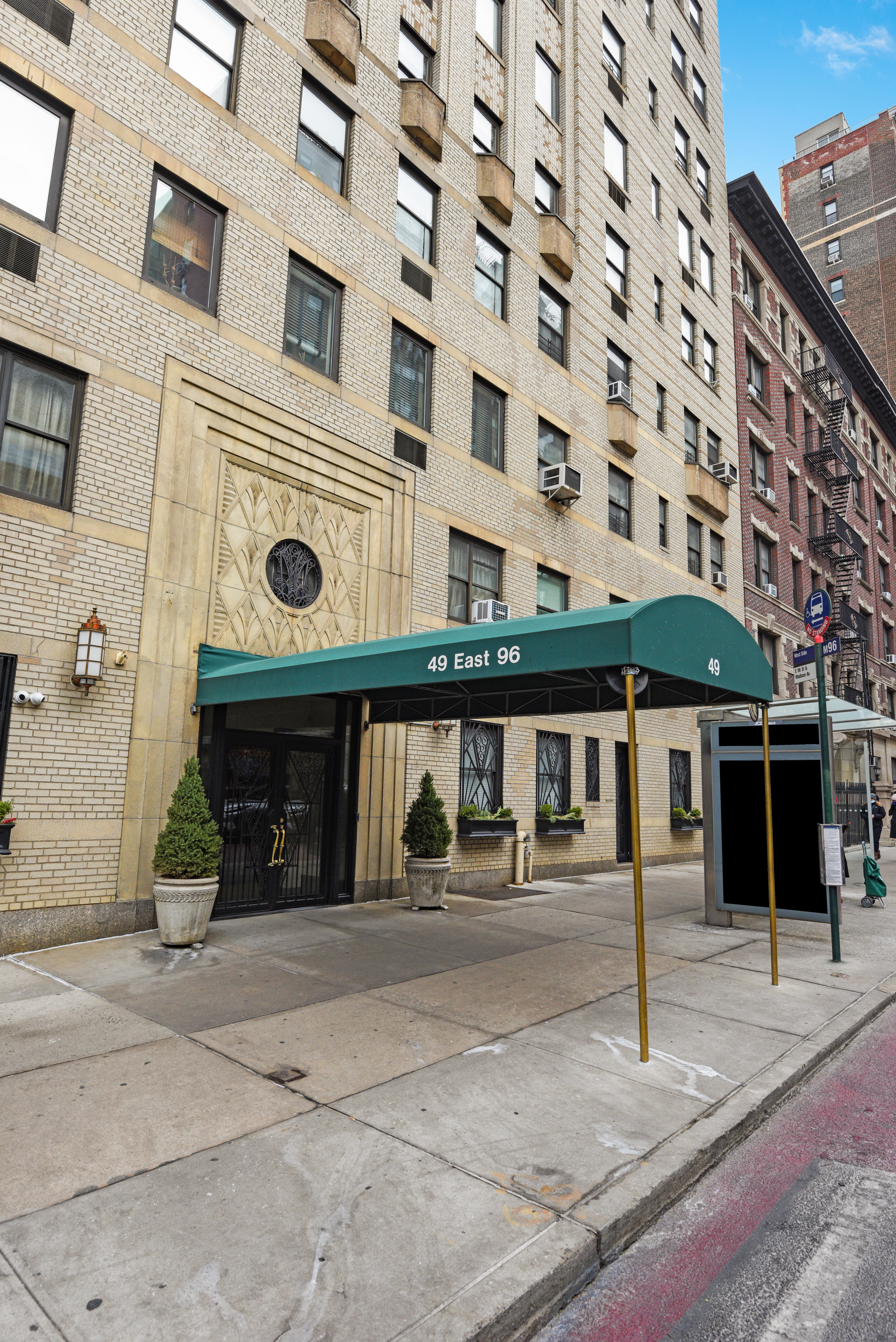 49 East 96th Street, Unit 8/9E Manhattan, NY 10128 - Photo 15 of 17 a front view of a building with glass windows