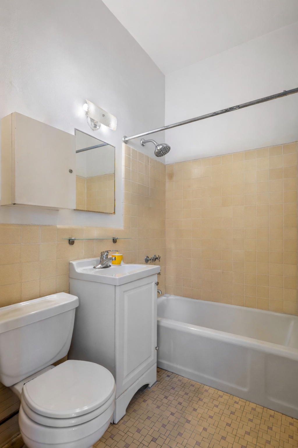 101 West 80th Street, Unit 2C Manhattan, NY 10024 - Photo 6 of 7 a bathroom with a toilet a sink and bathtub