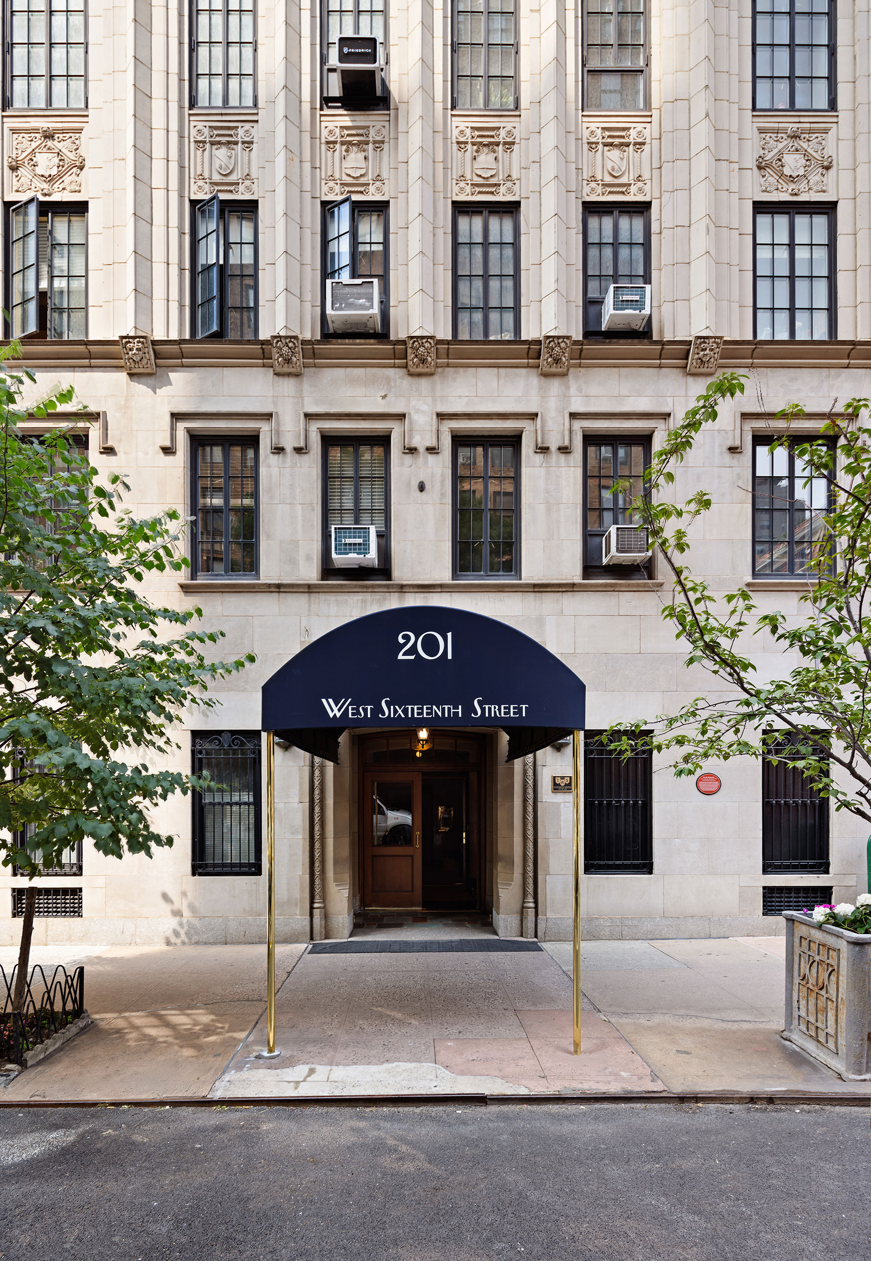 201 West 16th Street, Unit 9A Manhattan, NY 10011 - Photo 12 of 14 a front view of a building with street