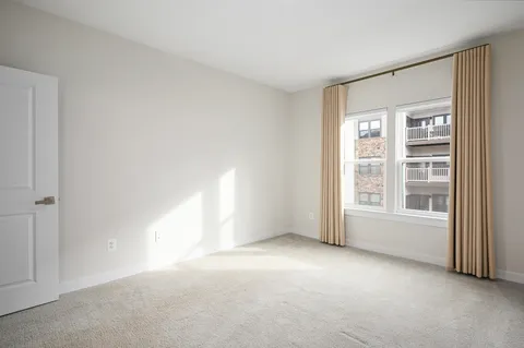 a view of empty room with windows