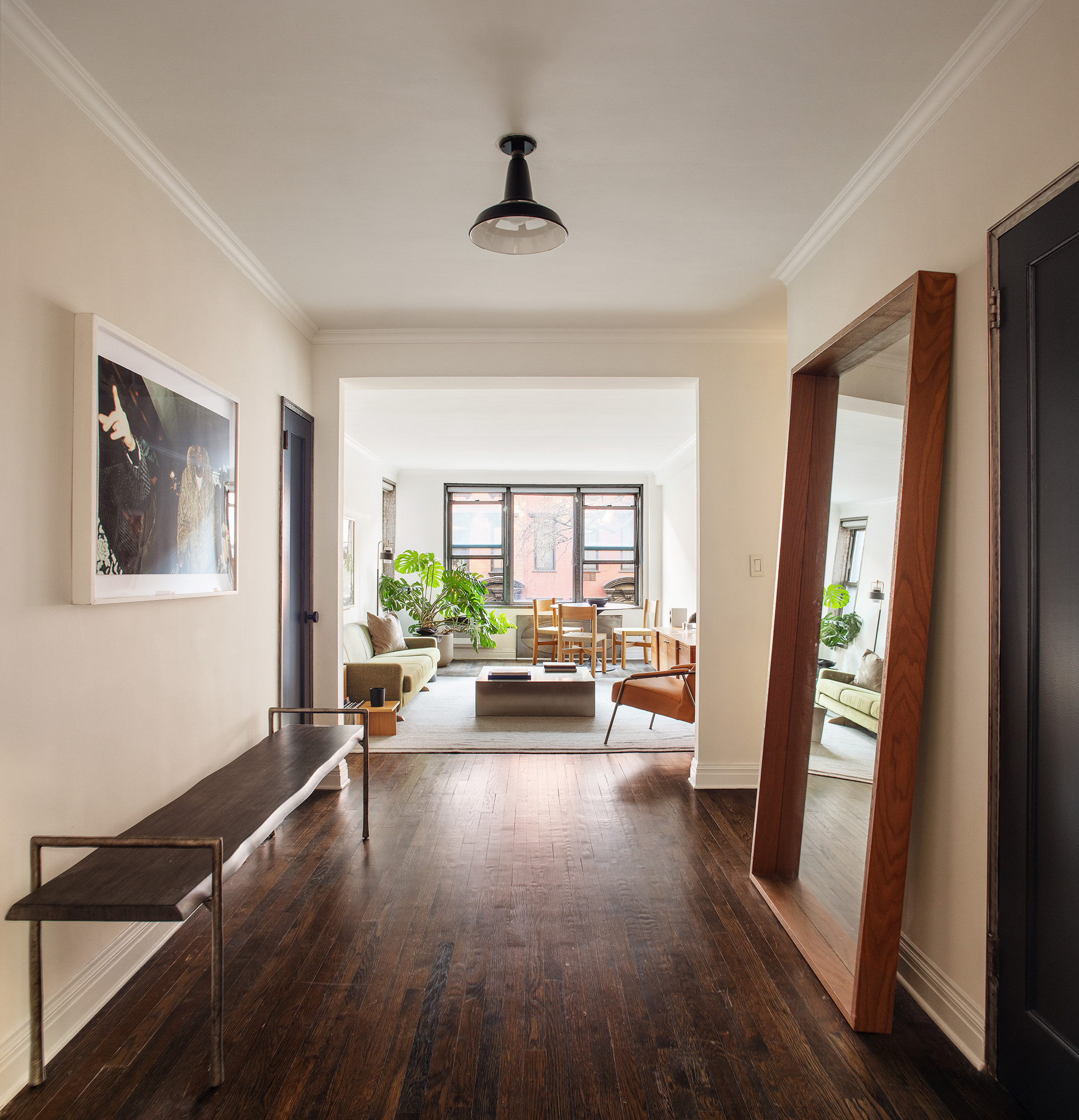 211 East 18th Street, Unit 2H Manhattan, NY 10003 - Photo 2 of 8 a living room with furniture and a large window
