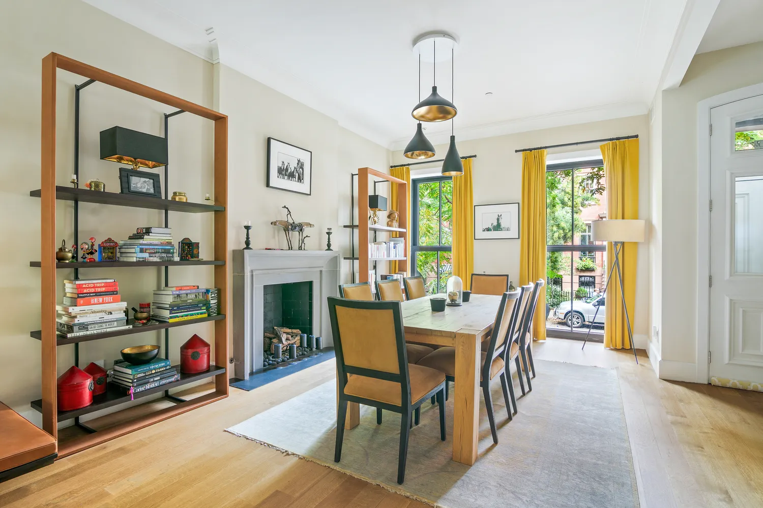a dining room with furniture and a window