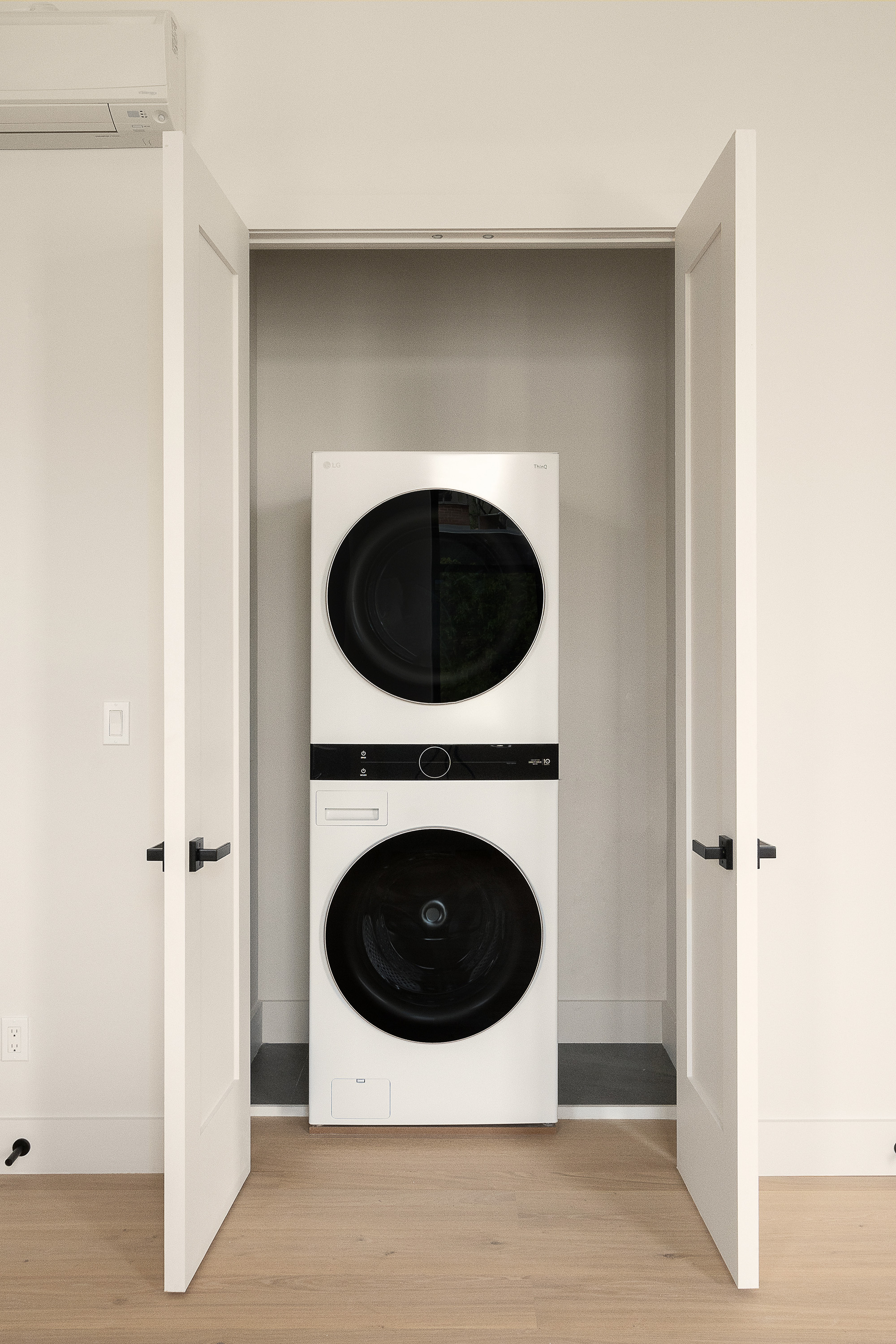 216 Grand Street, Unit LOFT 2 Brooklyn, NY 11211 - Photo 7 of 9 a utility room with dryer and washer