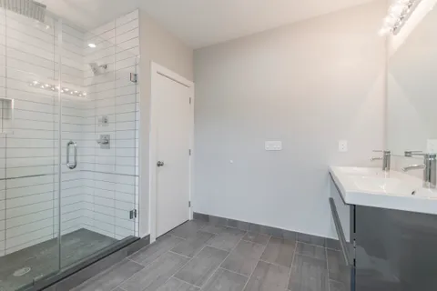 a bathroom with a sink and shower