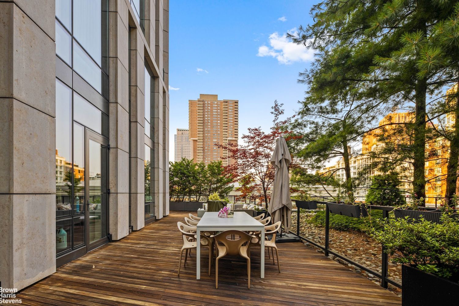 101 Warren Street, Unit 11L Manhattan, NY 10007 - Photo 22 of 26 a outdoor view with a sitting space and large trees
