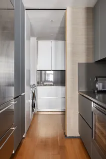 a kitchen with a refrigerator and a sink