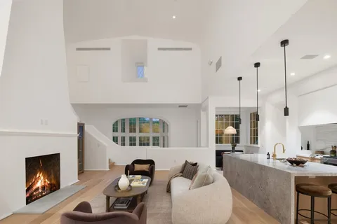 a living room with furniture and fireplace