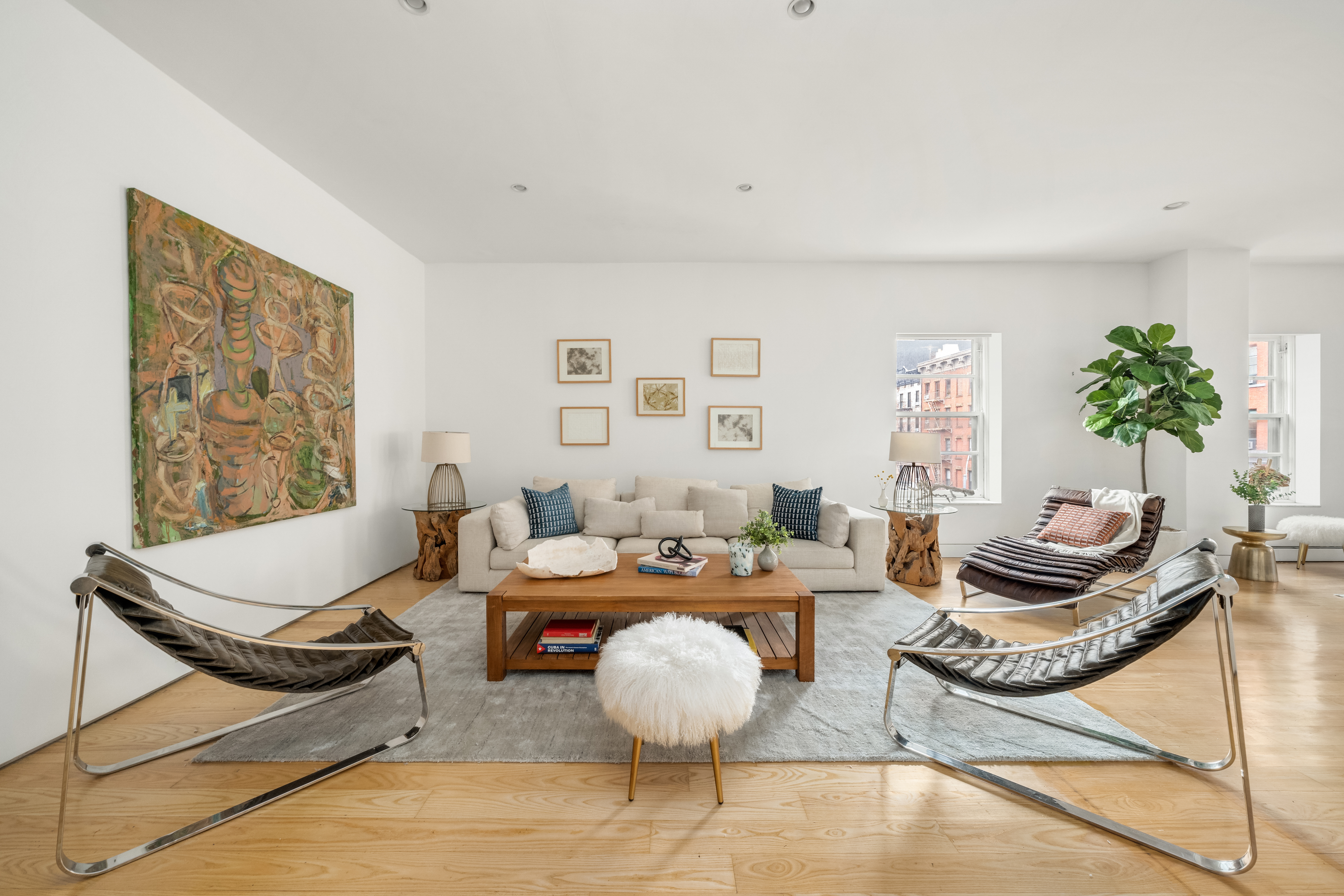719 Greenwich Street, Unit 3S Manhattan, NY 10014 - Photo 6 of 21 a living room with furniture and floor to ceiling window