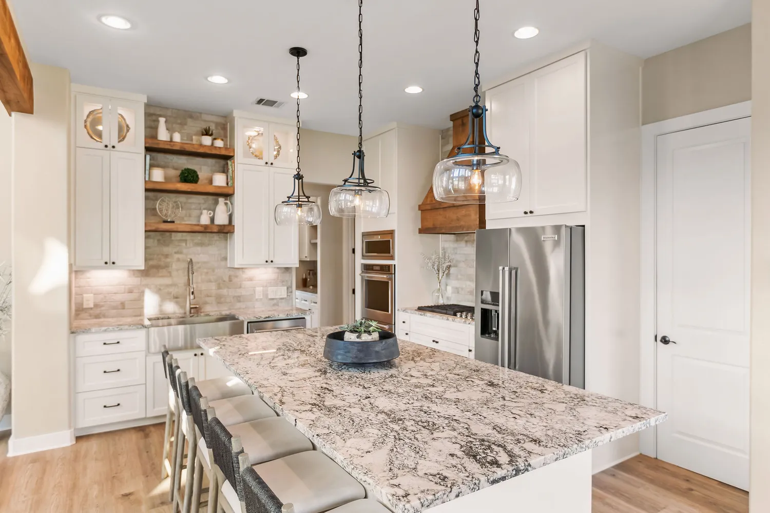 a bathroom with a double vanity sink a mirror and a shower