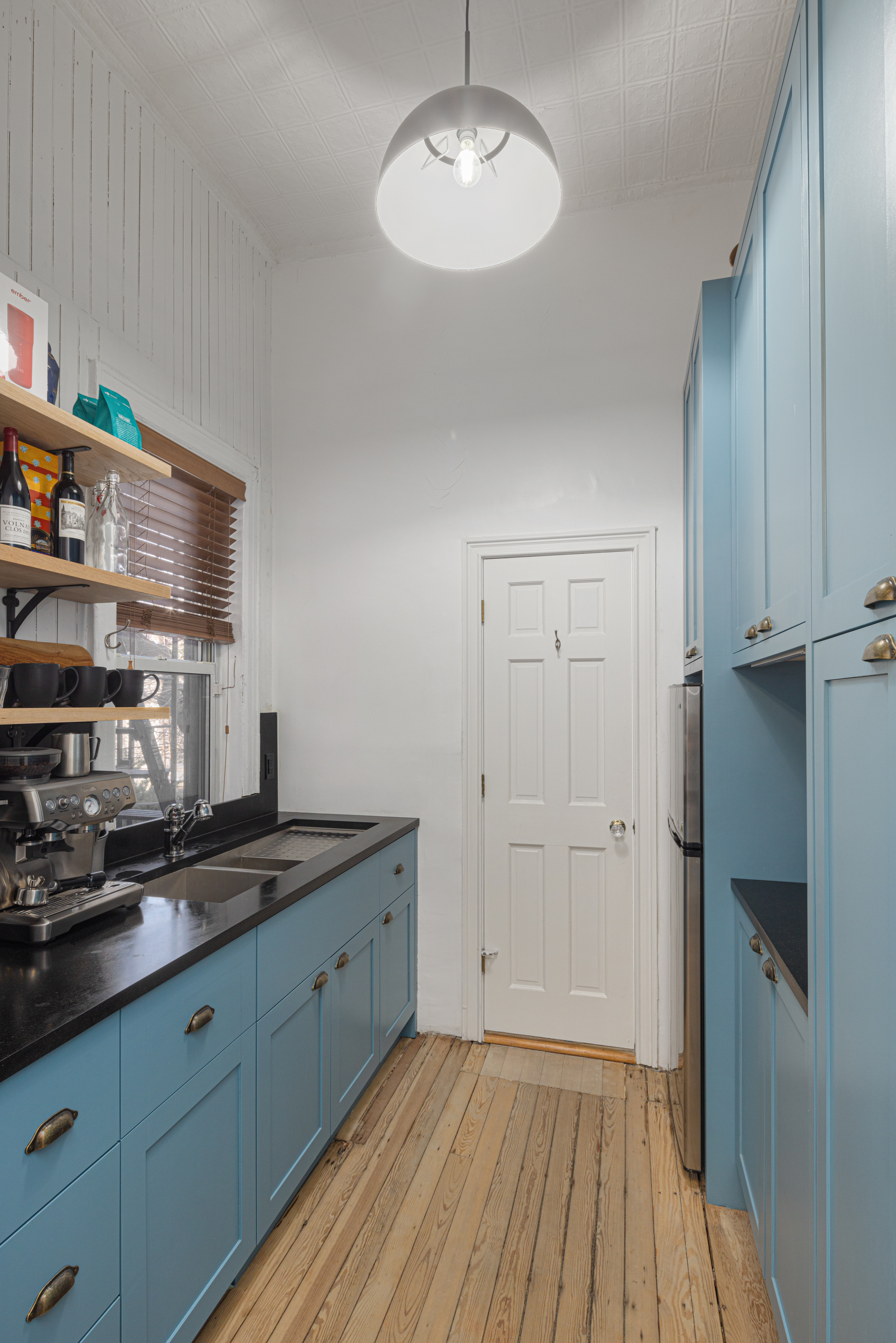 20 Strong Place Brooklyn, NY 11231 - Photo 4 of 21 a kitchen with cabinets and a wooden floor