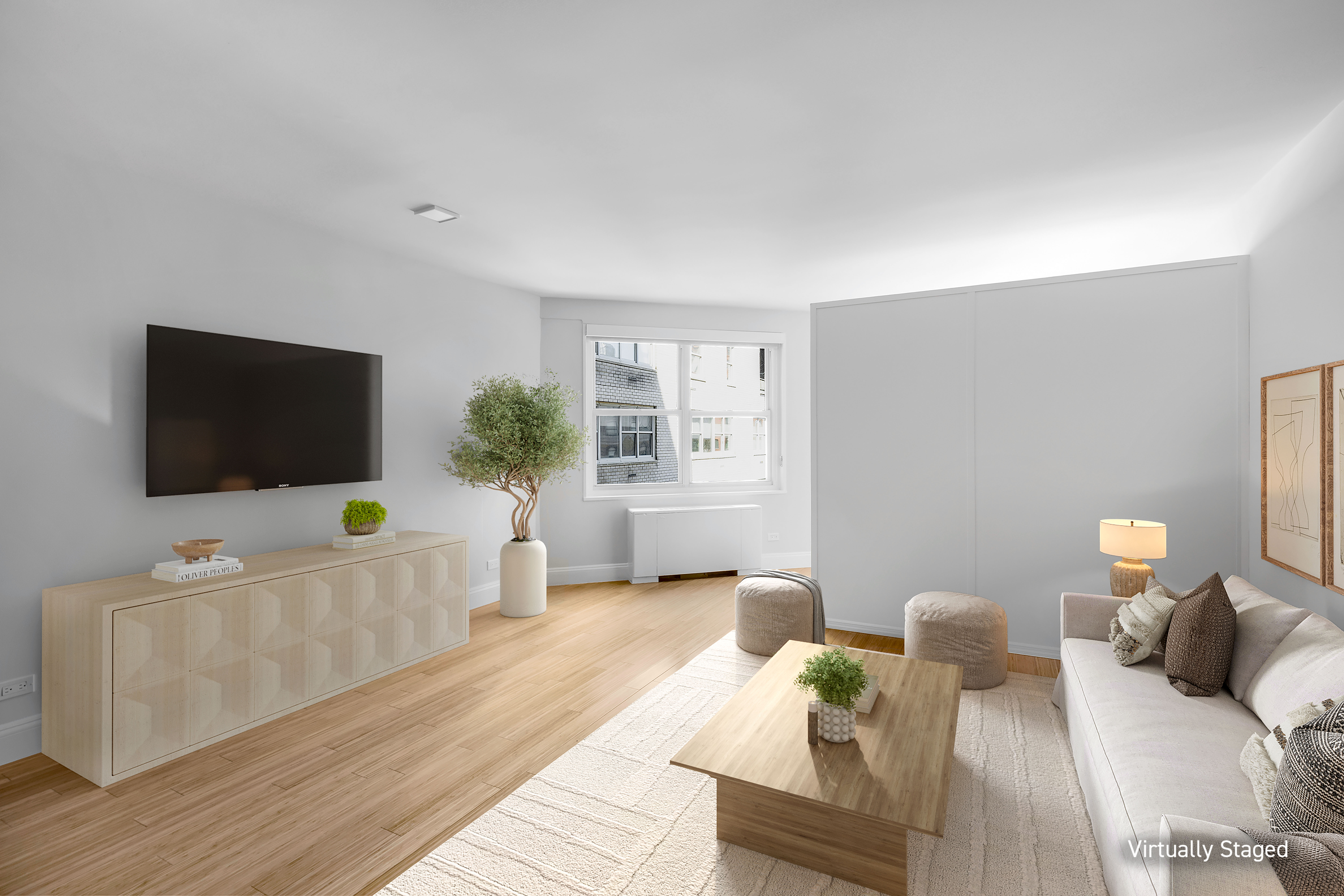 155 West 68th Street, Unit 1518 Manhattan, NY 10023 - Photo 1 of 10 a living room with furniture and a flat screen tv