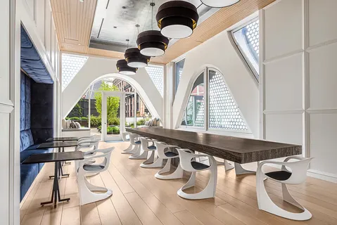 a very nice looking living room with a large window