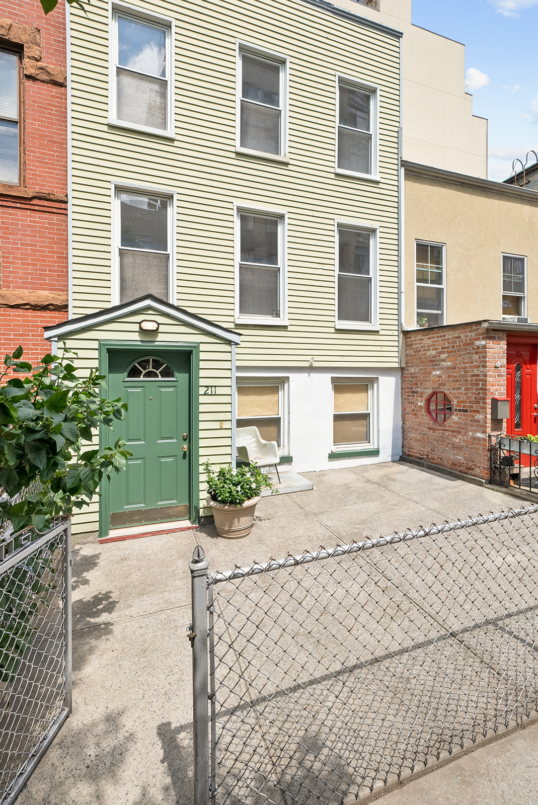 211 12th Street, Unit 2 Brooklyn, NY 11215 - Photo 6 of 7 a front view of a house having yard