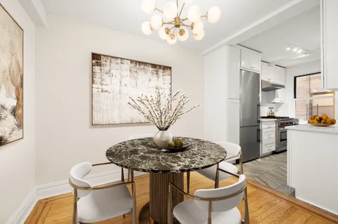 a view of kitchen with furniture and wooden floor