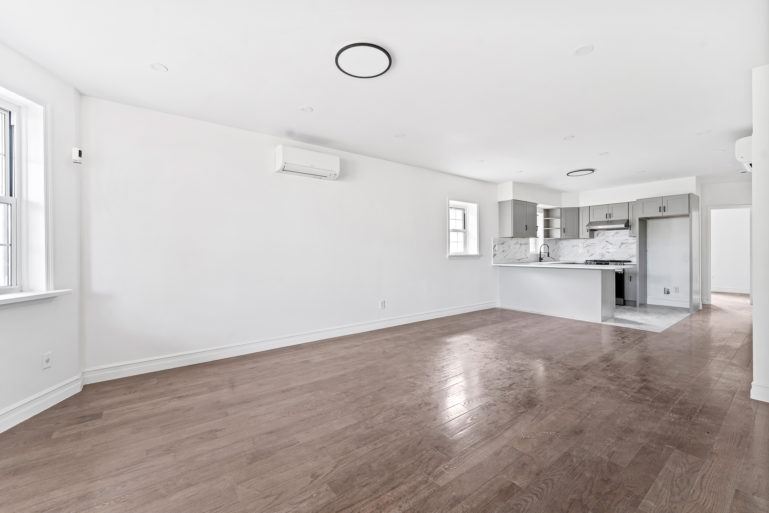 65 Bay 23rd Street, Unit 2 Brooklyn, NY 11214 - Photo 2 of 16 a view of a kitchen with a sink and a refrigerator