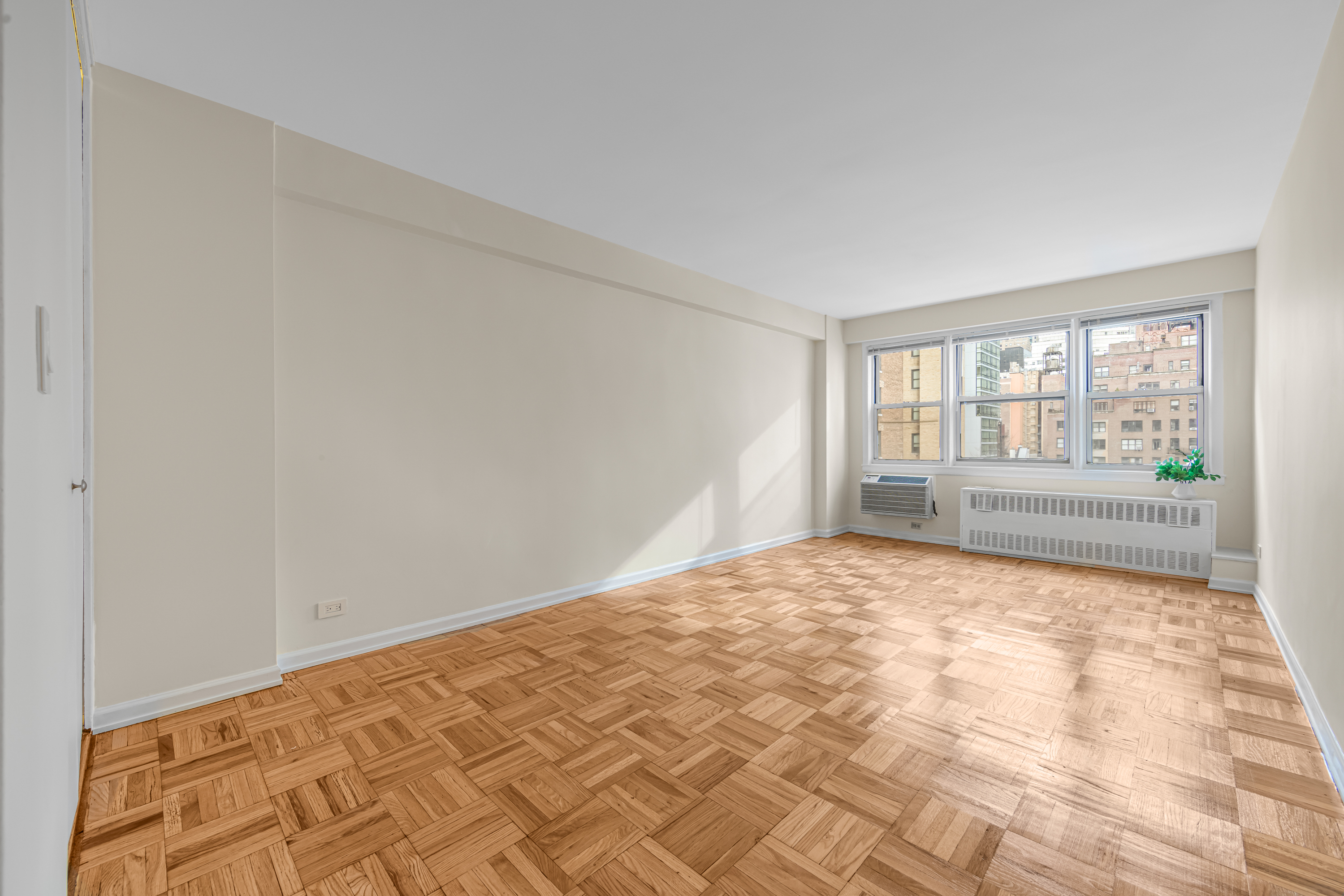 150 East 37th Street, Unit 10F Manhattan, NY 10016 - Photo 4 of 20 a view of an empty room and window