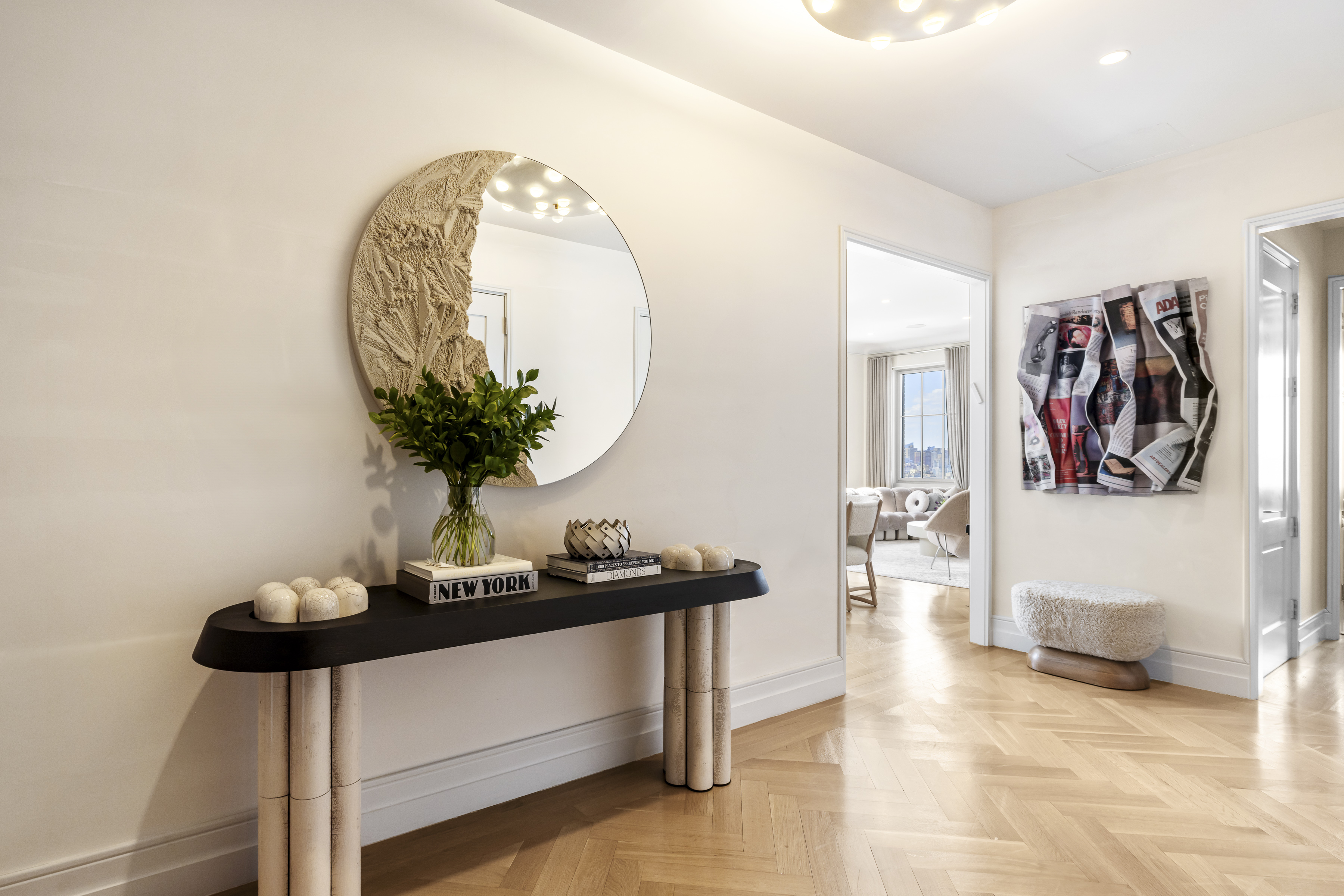 301 East 80th Street, Unit 25B Manhattan, NY 10075 - Photo 12 of 38 a living room with furniture and a potted plant